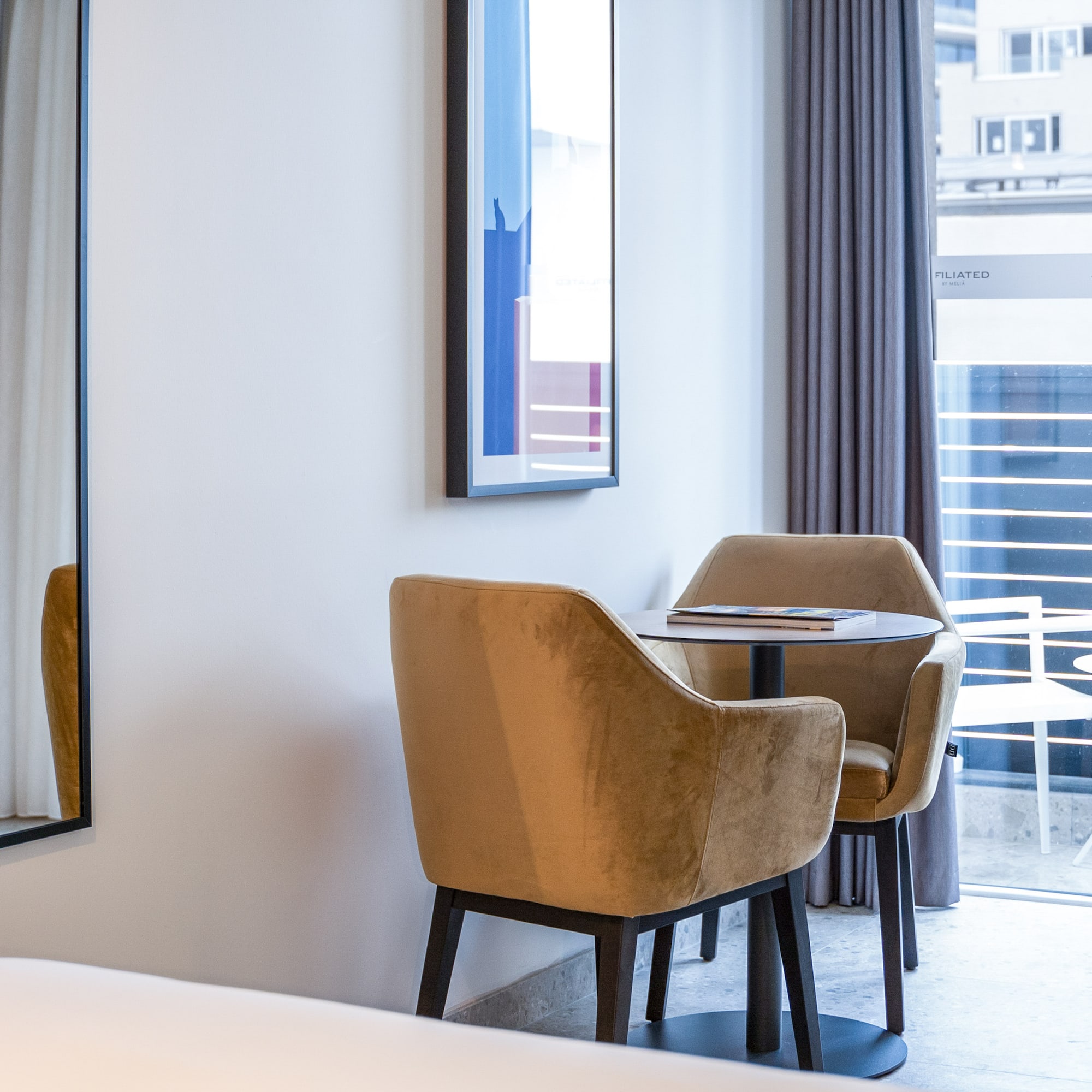 a room with a table and chairs