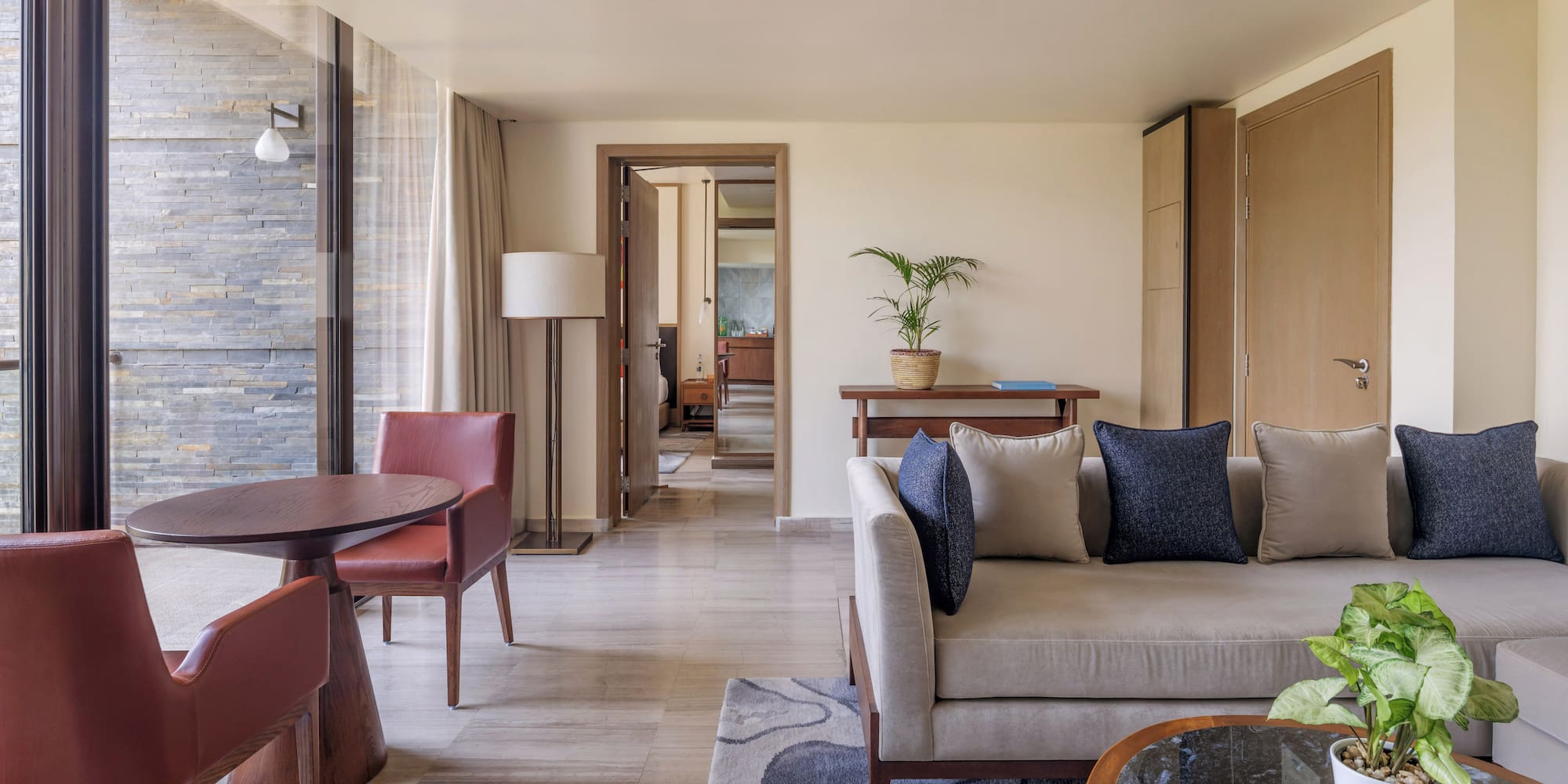 a living room with a couch and chairs