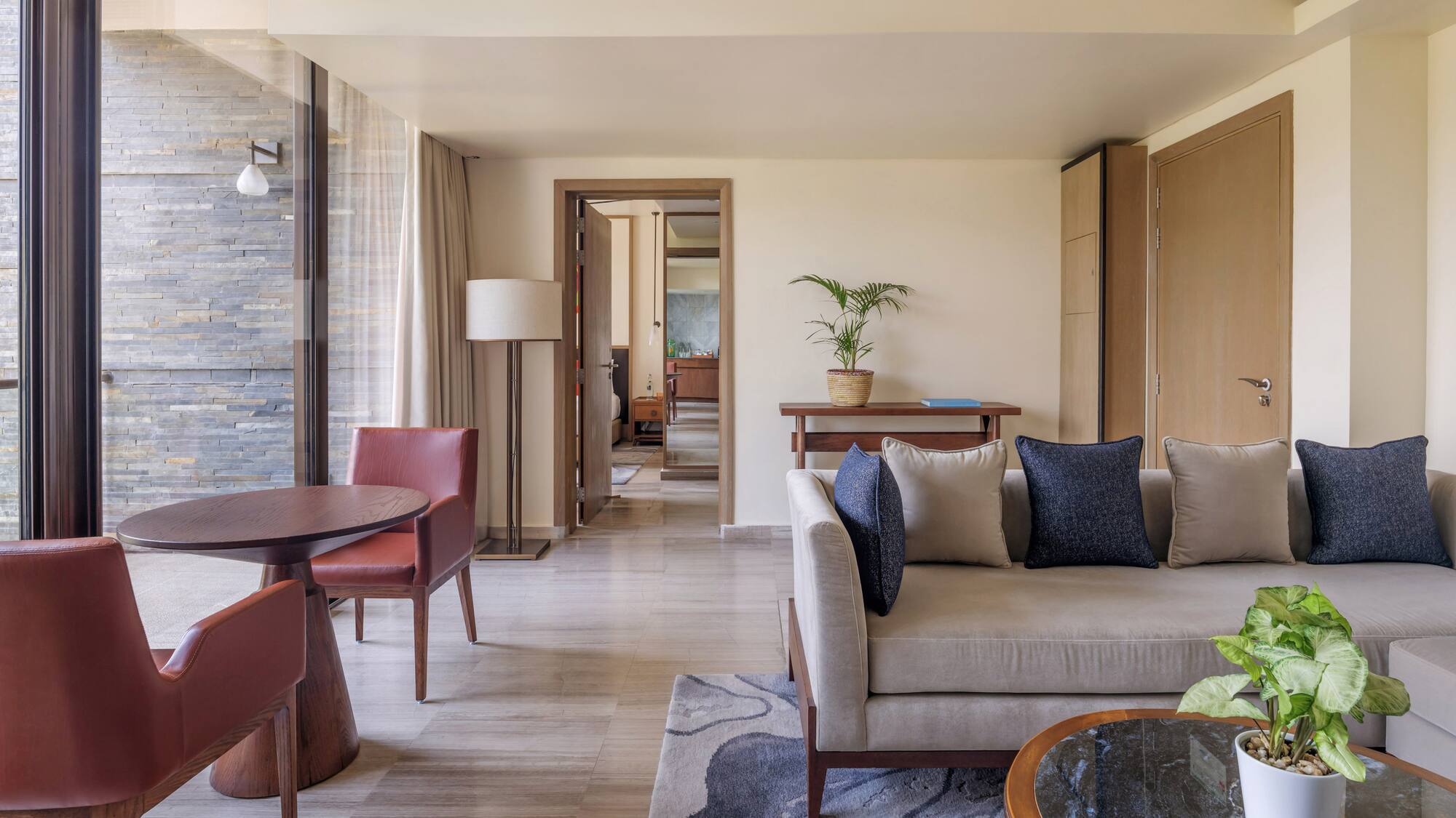 a living room with a couch and chairs