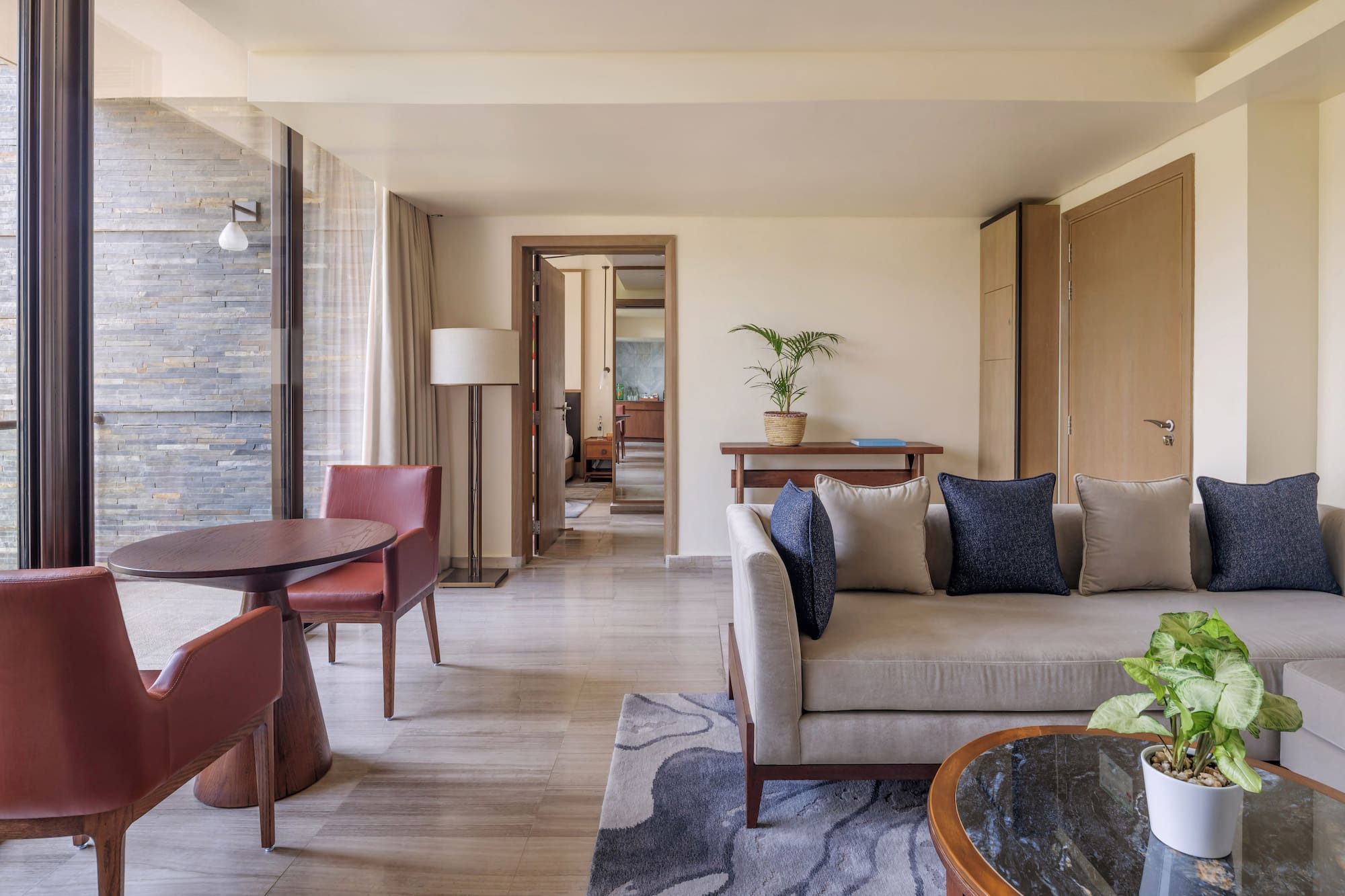 a living room with a couch and chairs