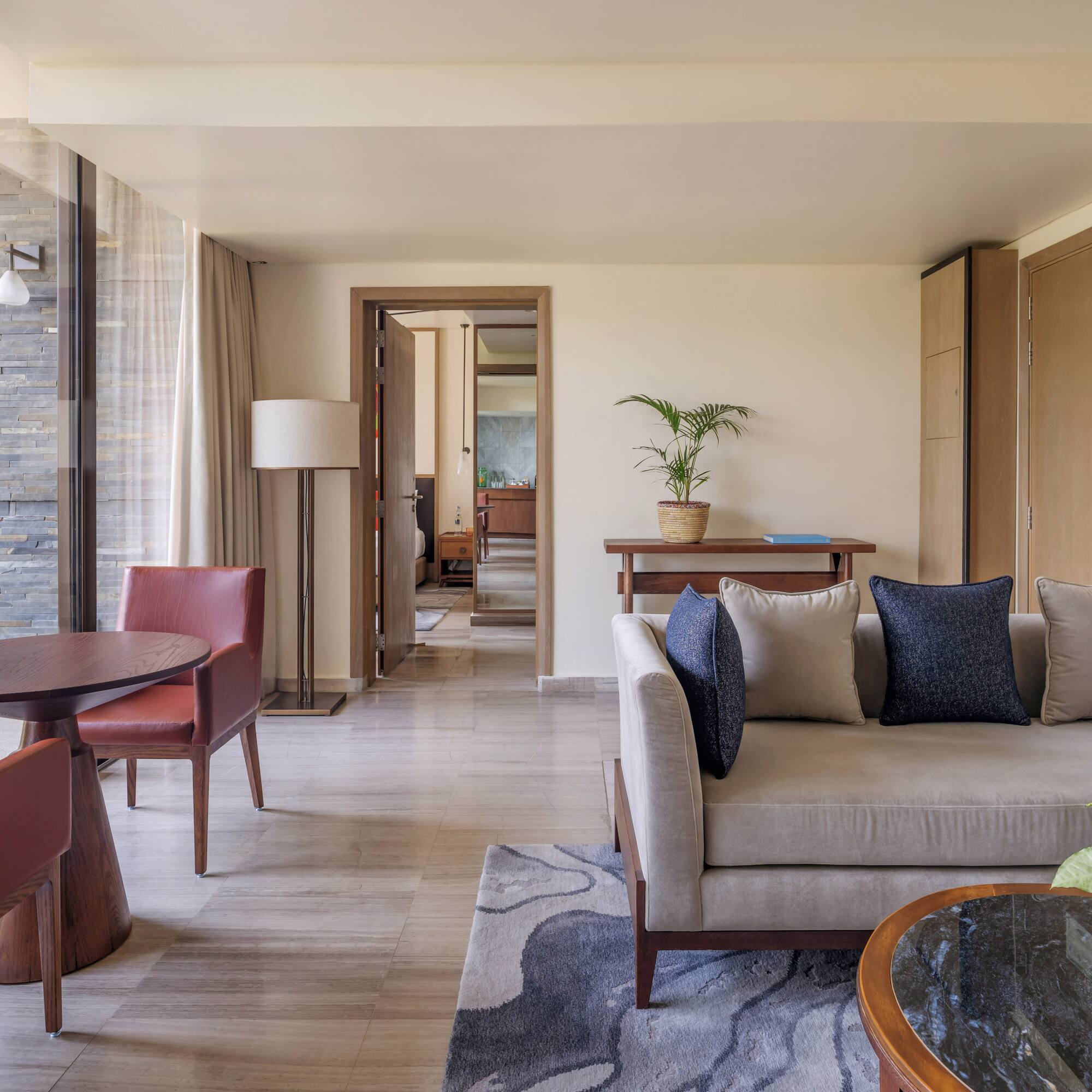 a living room with a couch and chairs