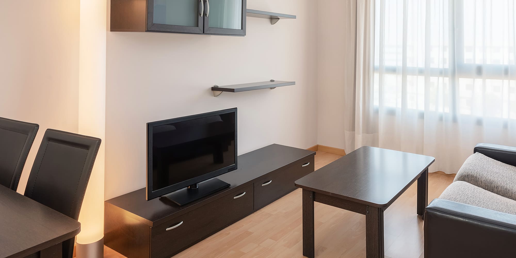a living room with a tv and a table