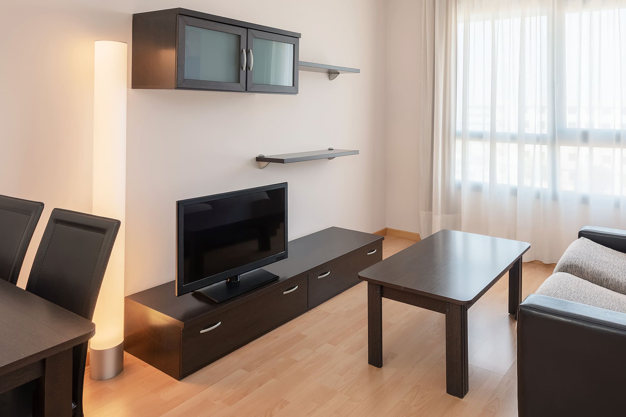 a living room with a tv and a table