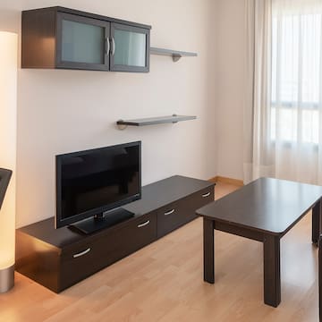 a living room with a tv and a table