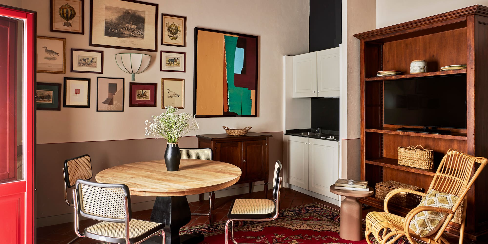 a room with a round table and chairs