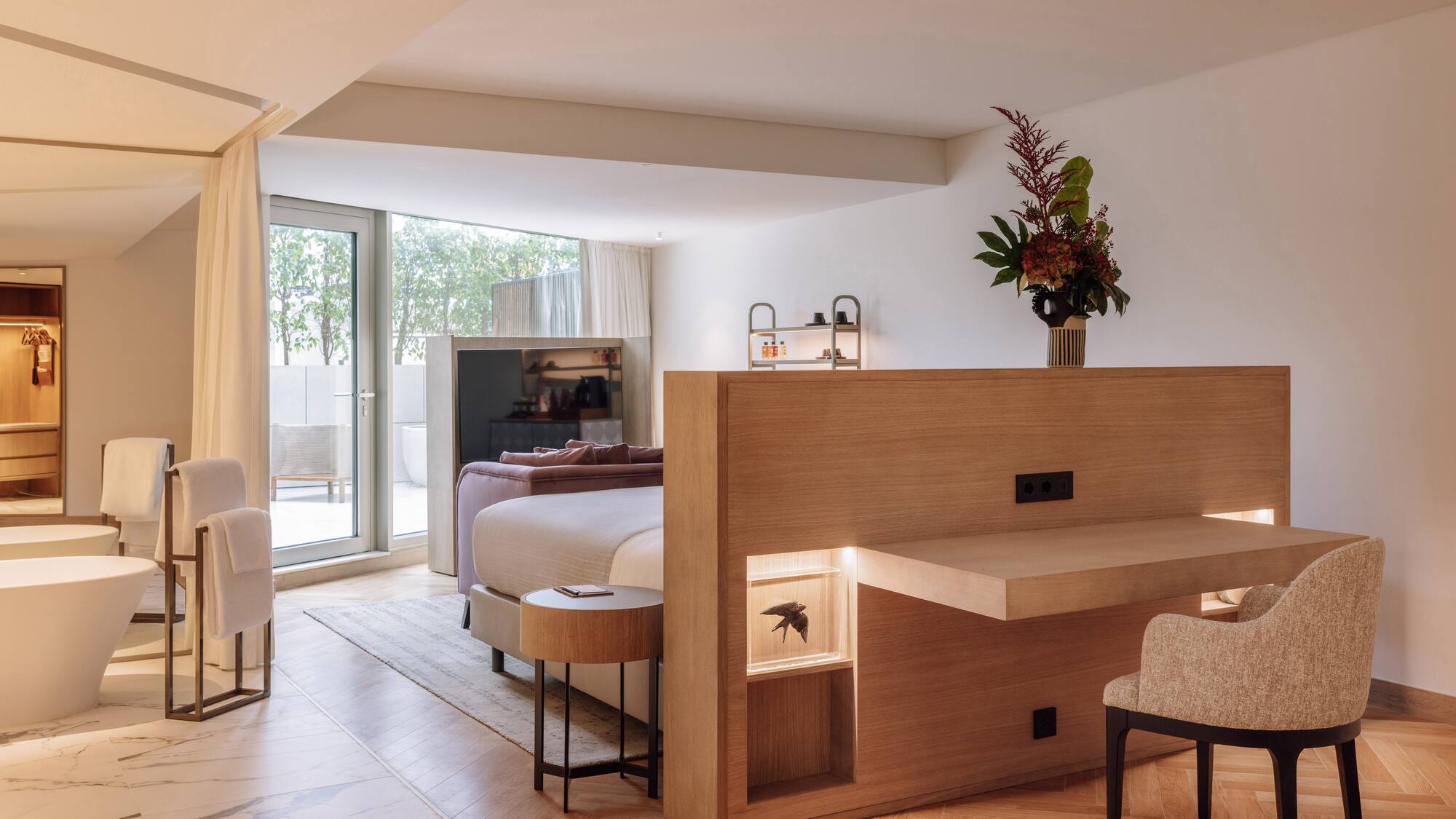 a room with a bed and a desk