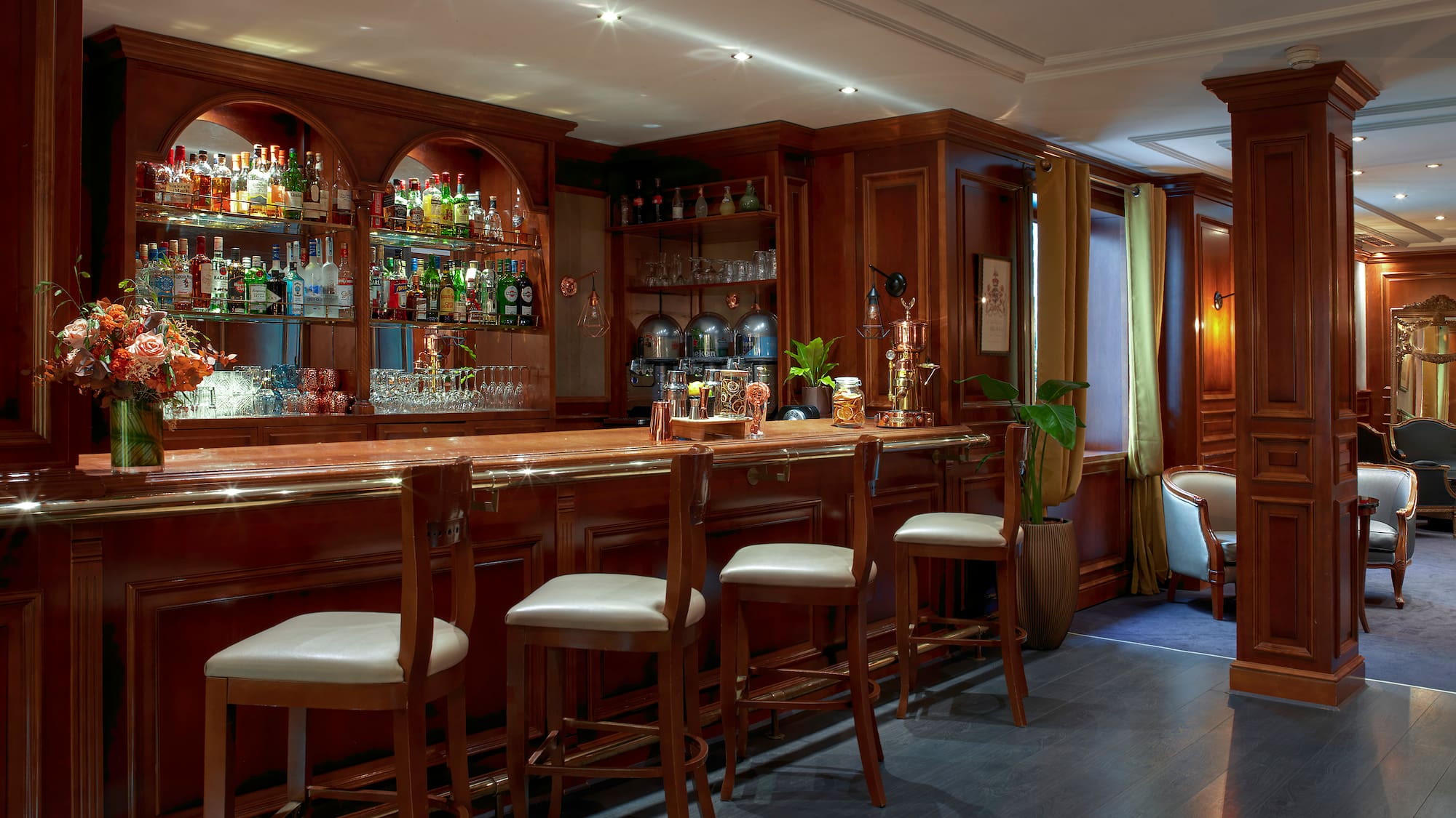 a bar with shelves and chairs
