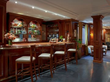 a bar with shelves and chairs