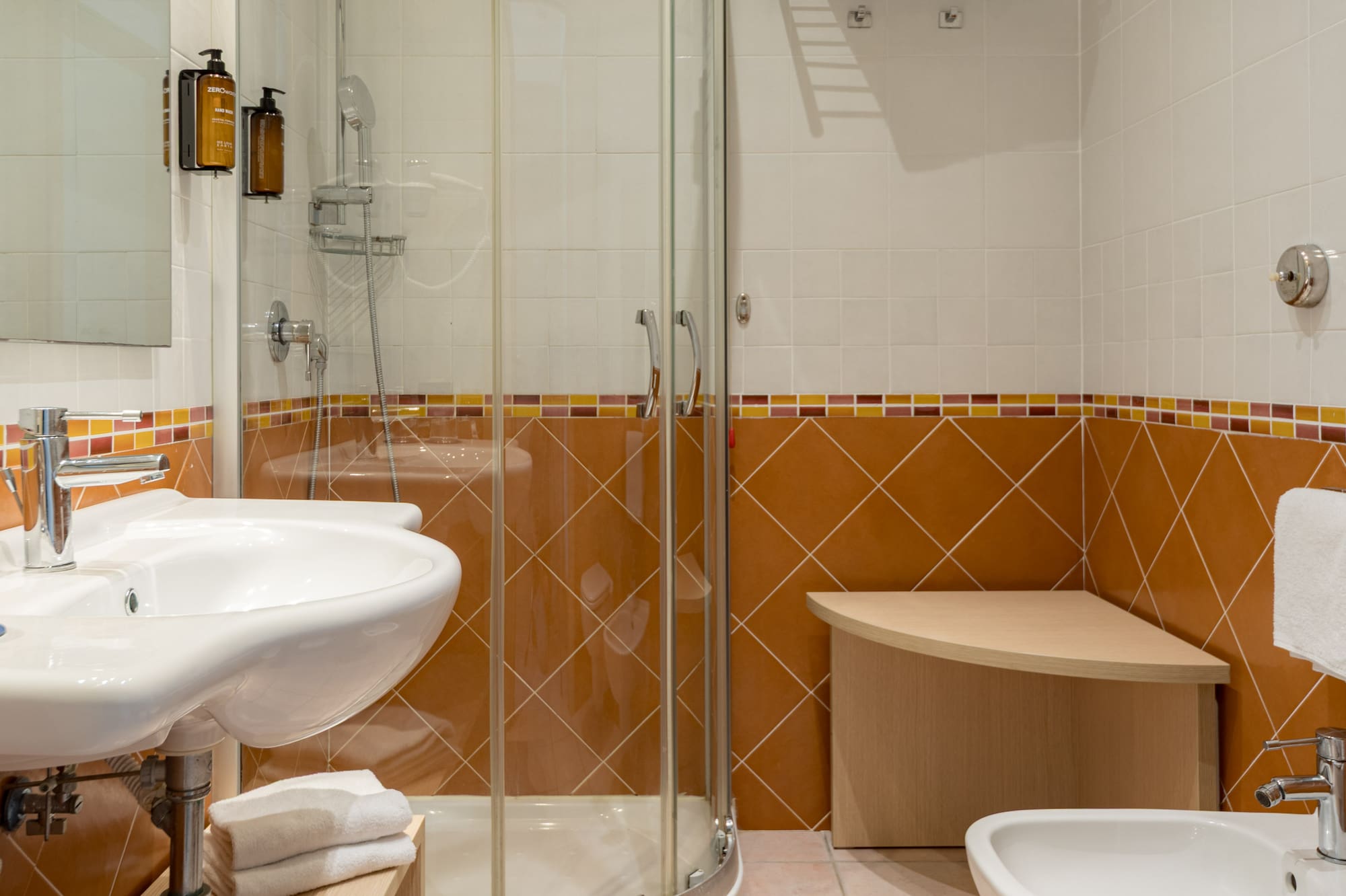 a bathroom with a shower and sink