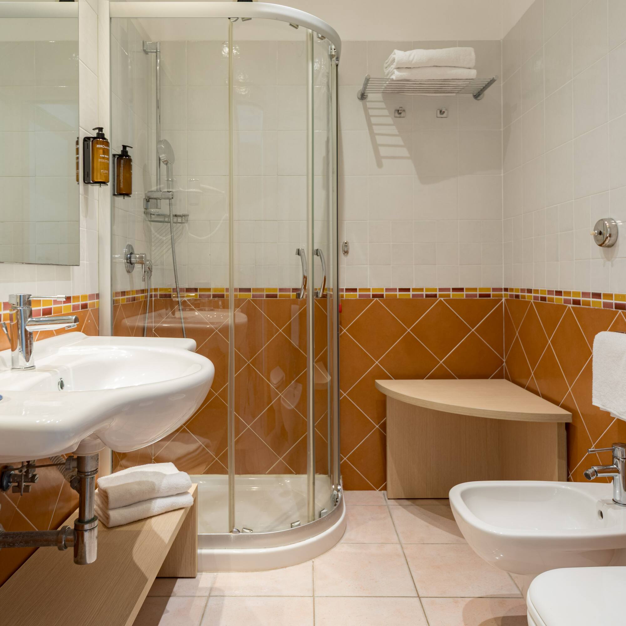 a bathroom with a shower and sink