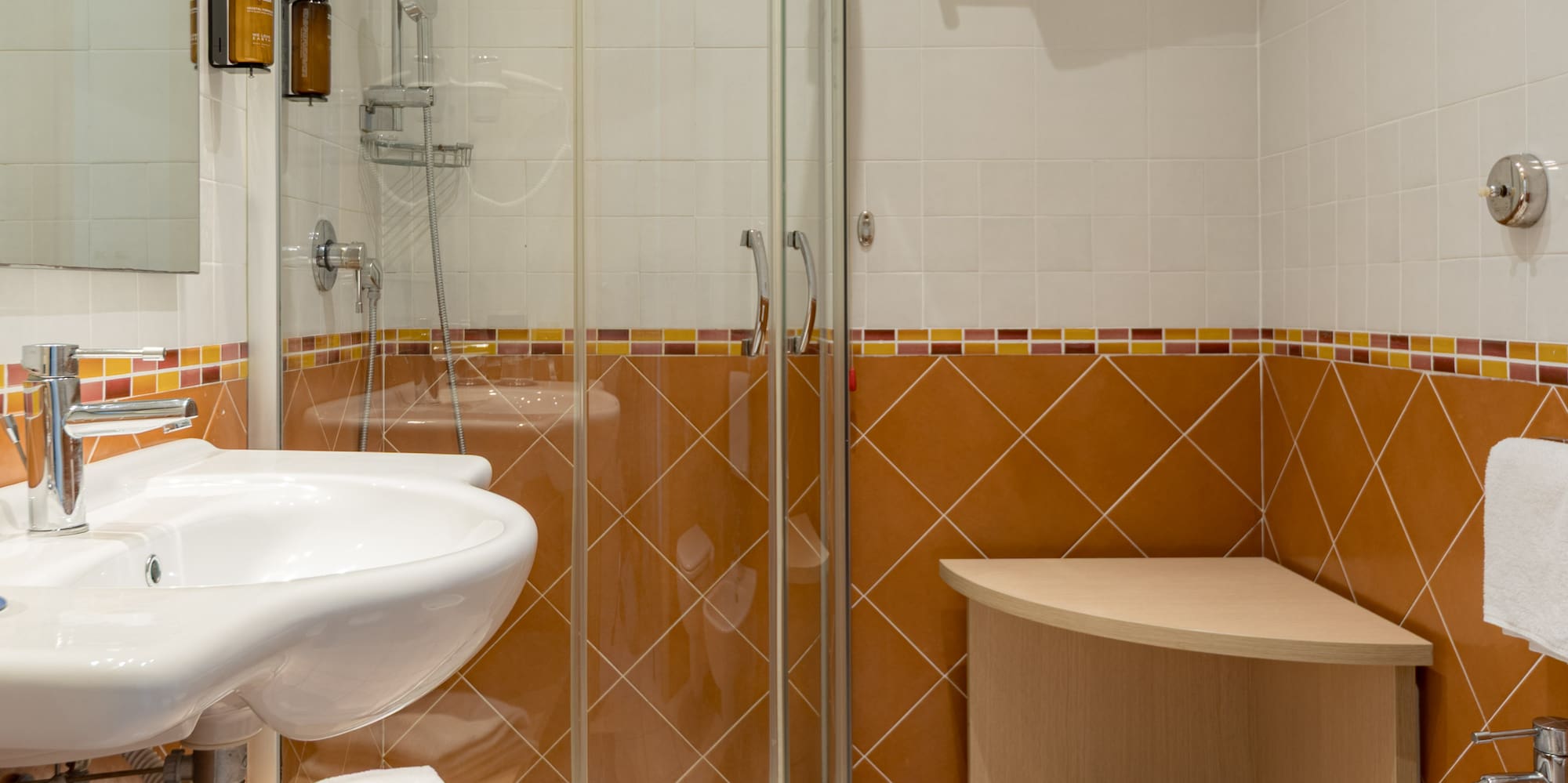 a bathroom with a shower and sink