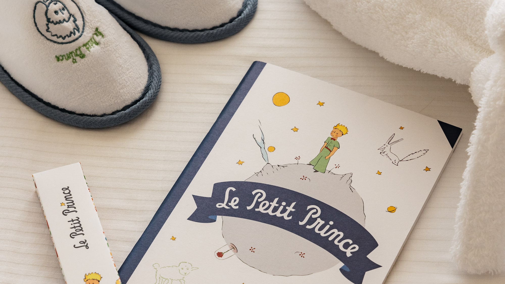 a book and slippers on a table