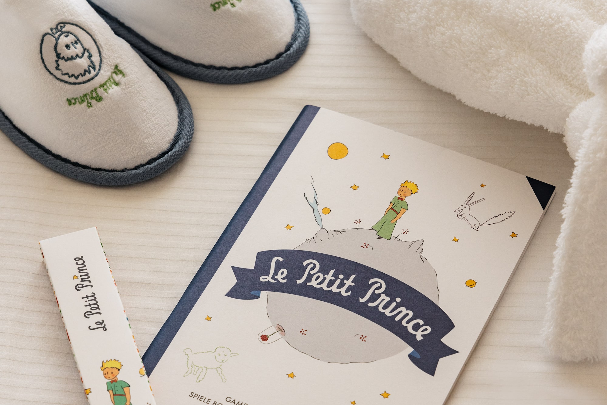 a book and slippers on a table