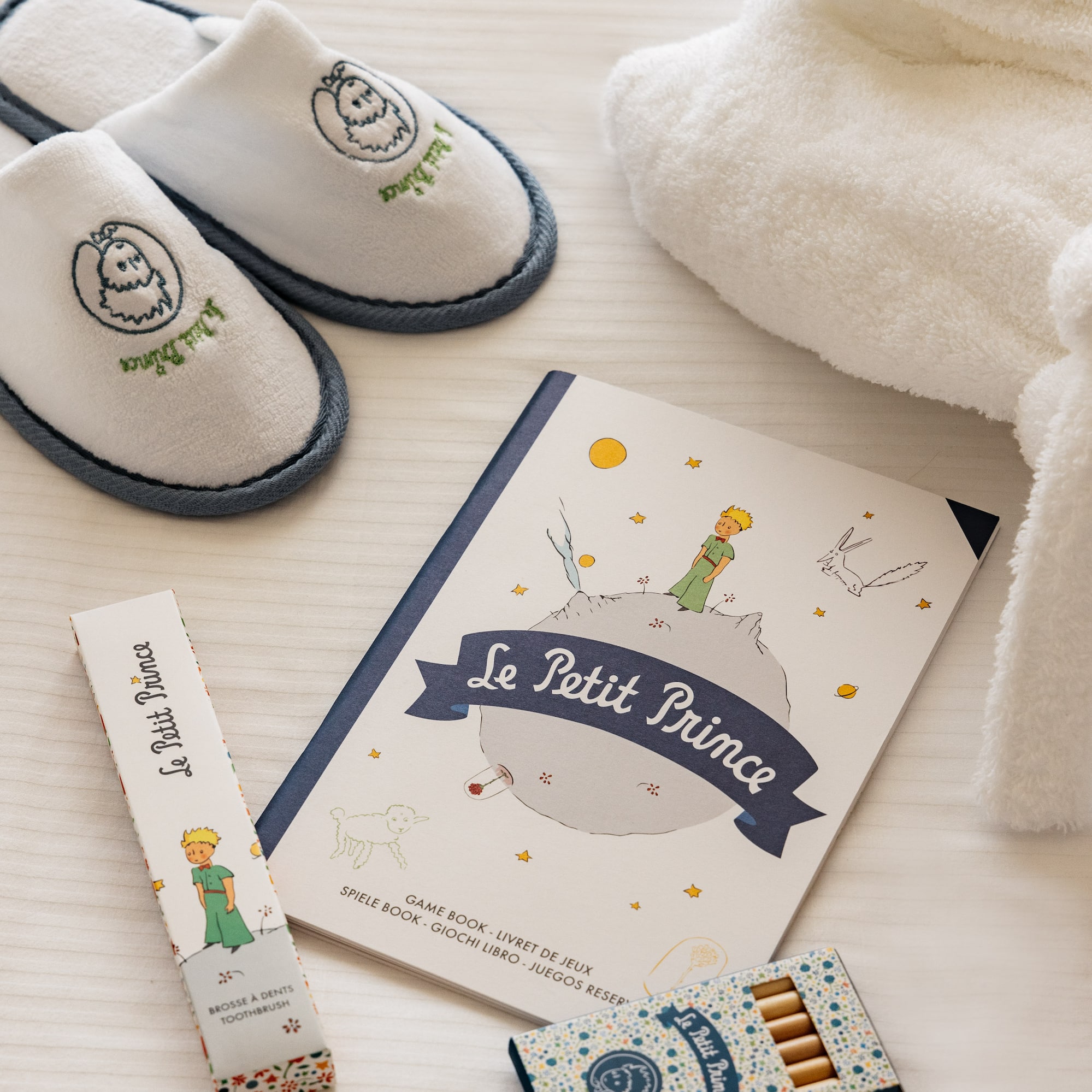 a book and slippers on a table