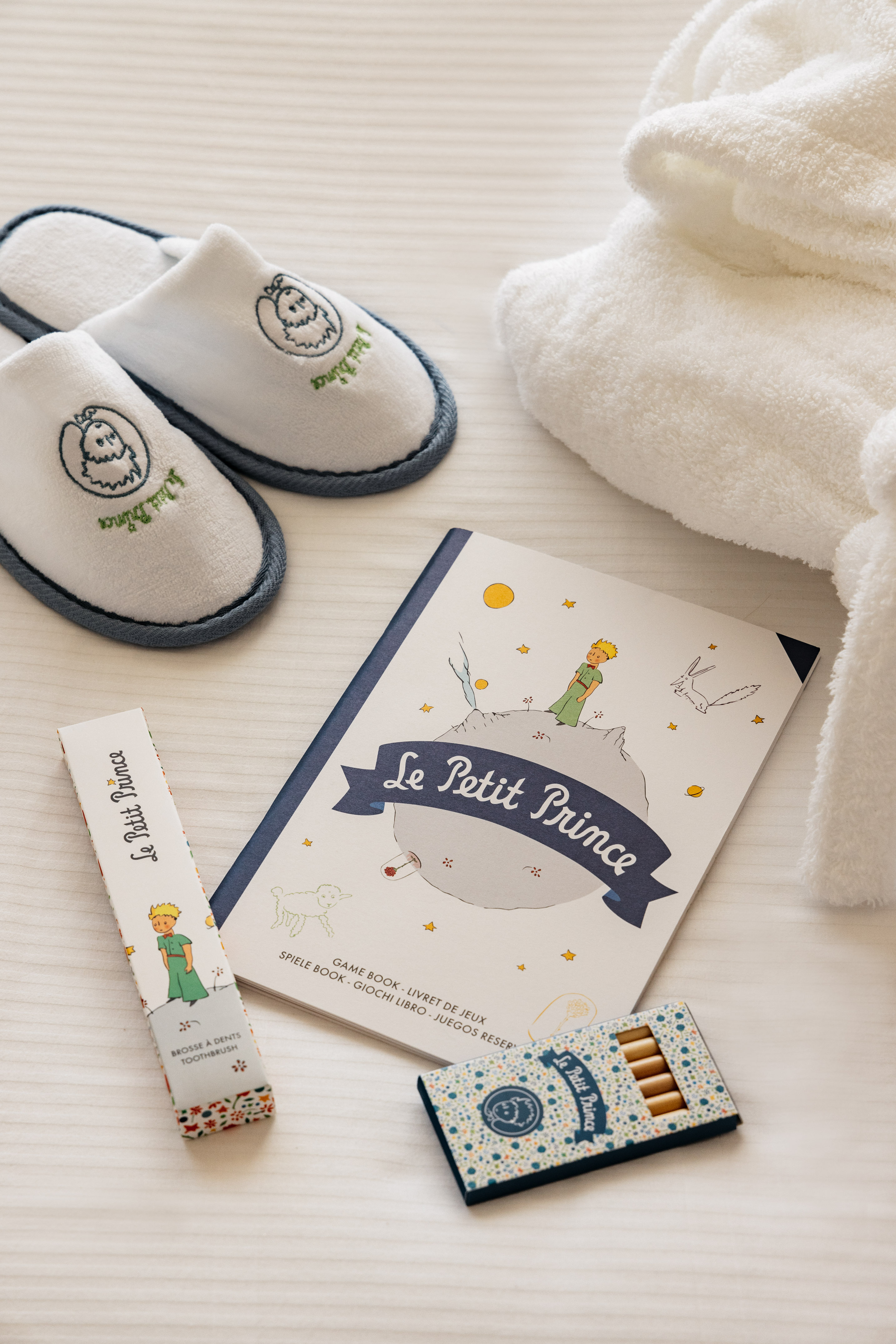 a book and slippers on a table