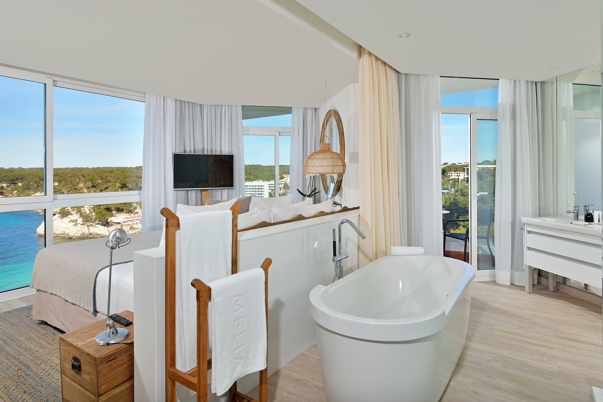 a bathroom with a tub and a mirror