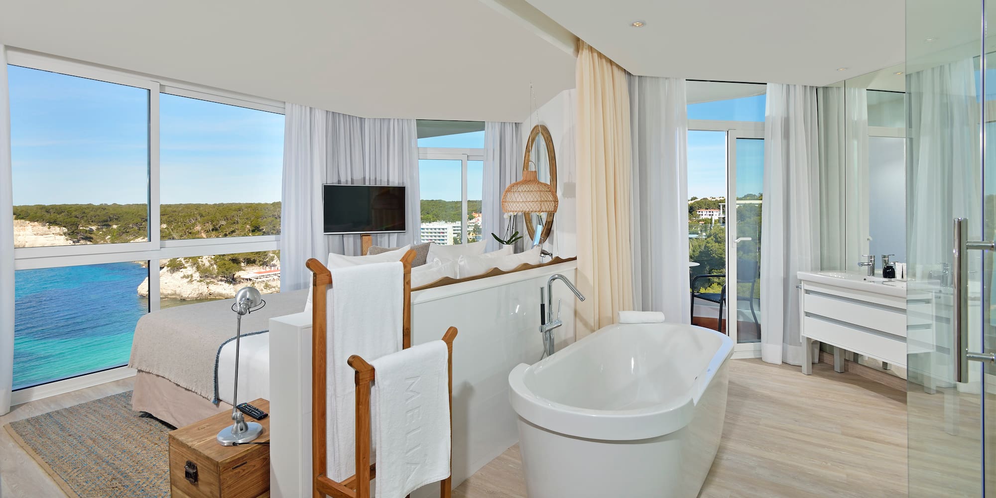 a bathroom with a tub and a mirror