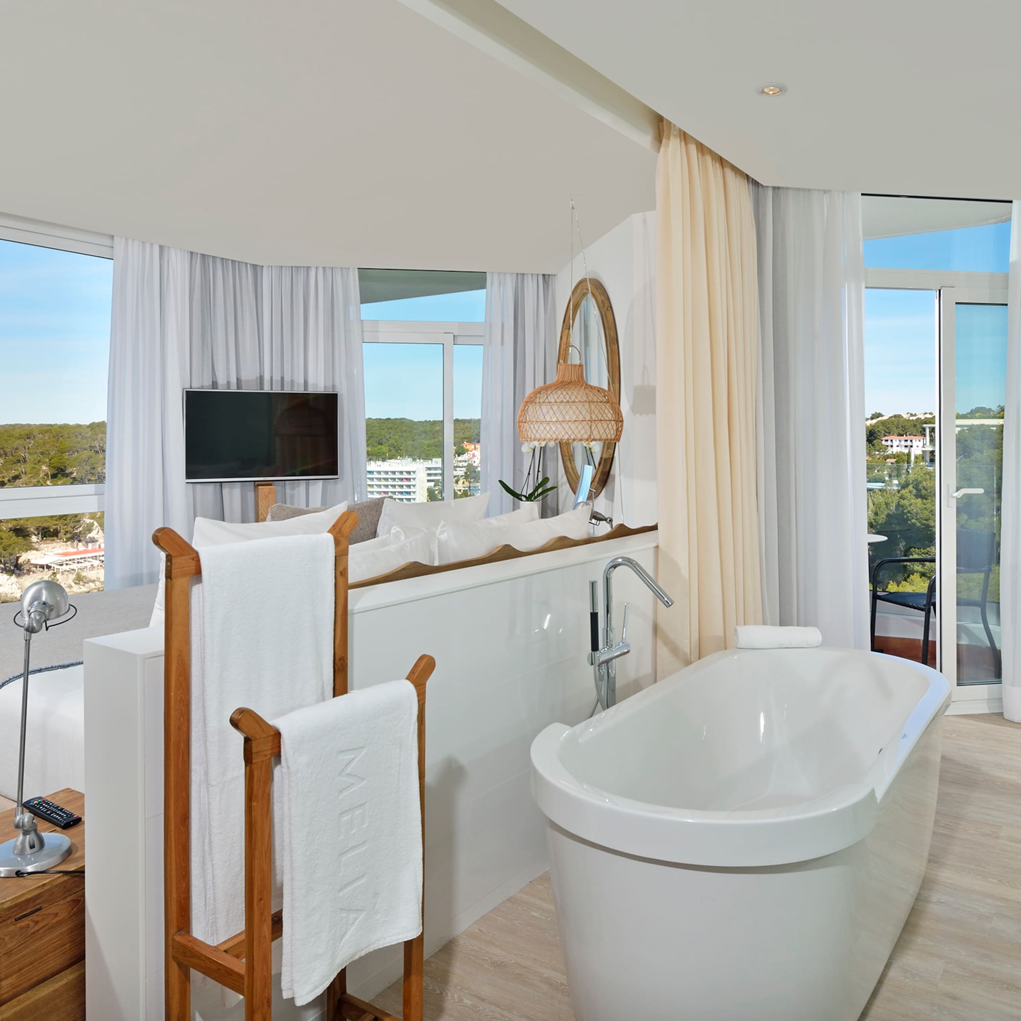 a bathroom with a tub and a mirror