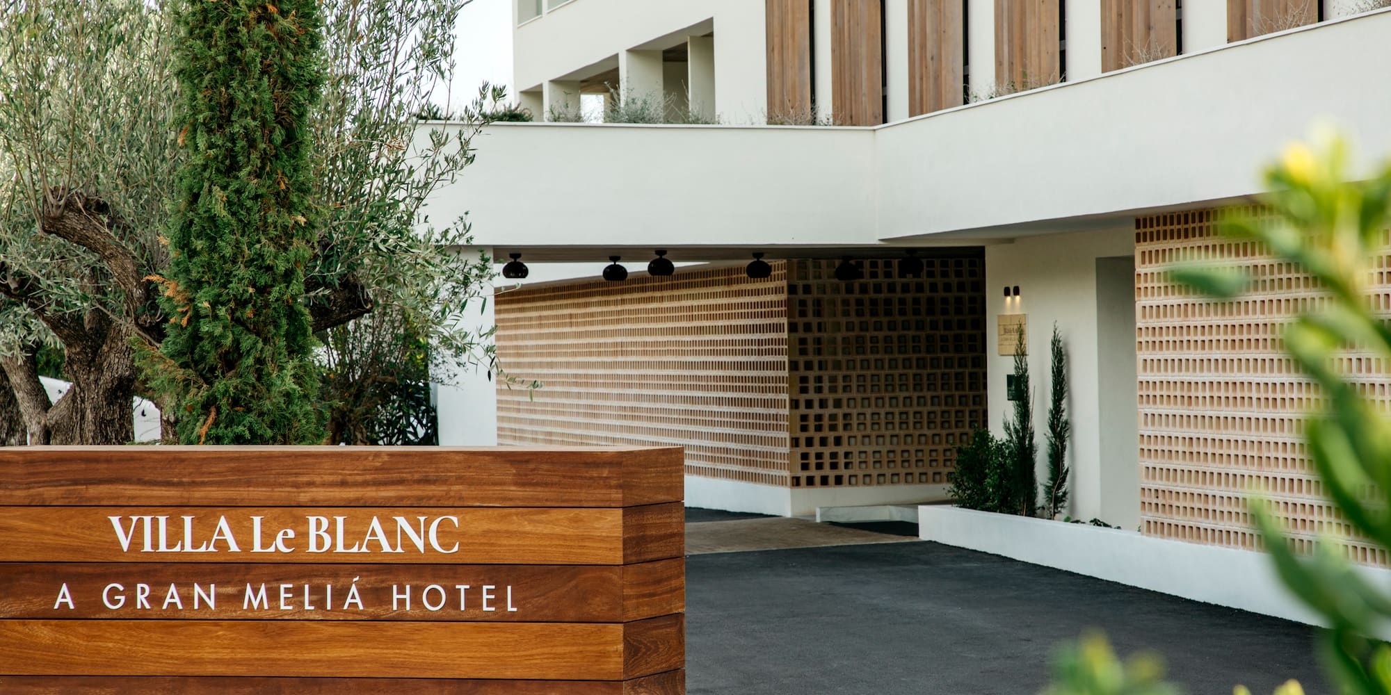 a sign in front of a hotel