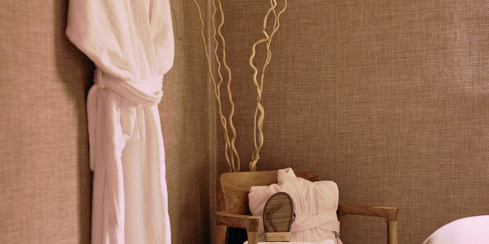 a white robe on a swinger