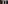 Two white Meliã bathrobes and hotel slippers in a dark wood wardrobe.
