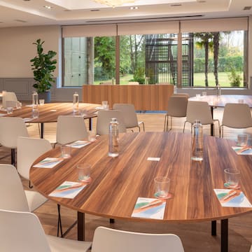 a room with a round table and chairs