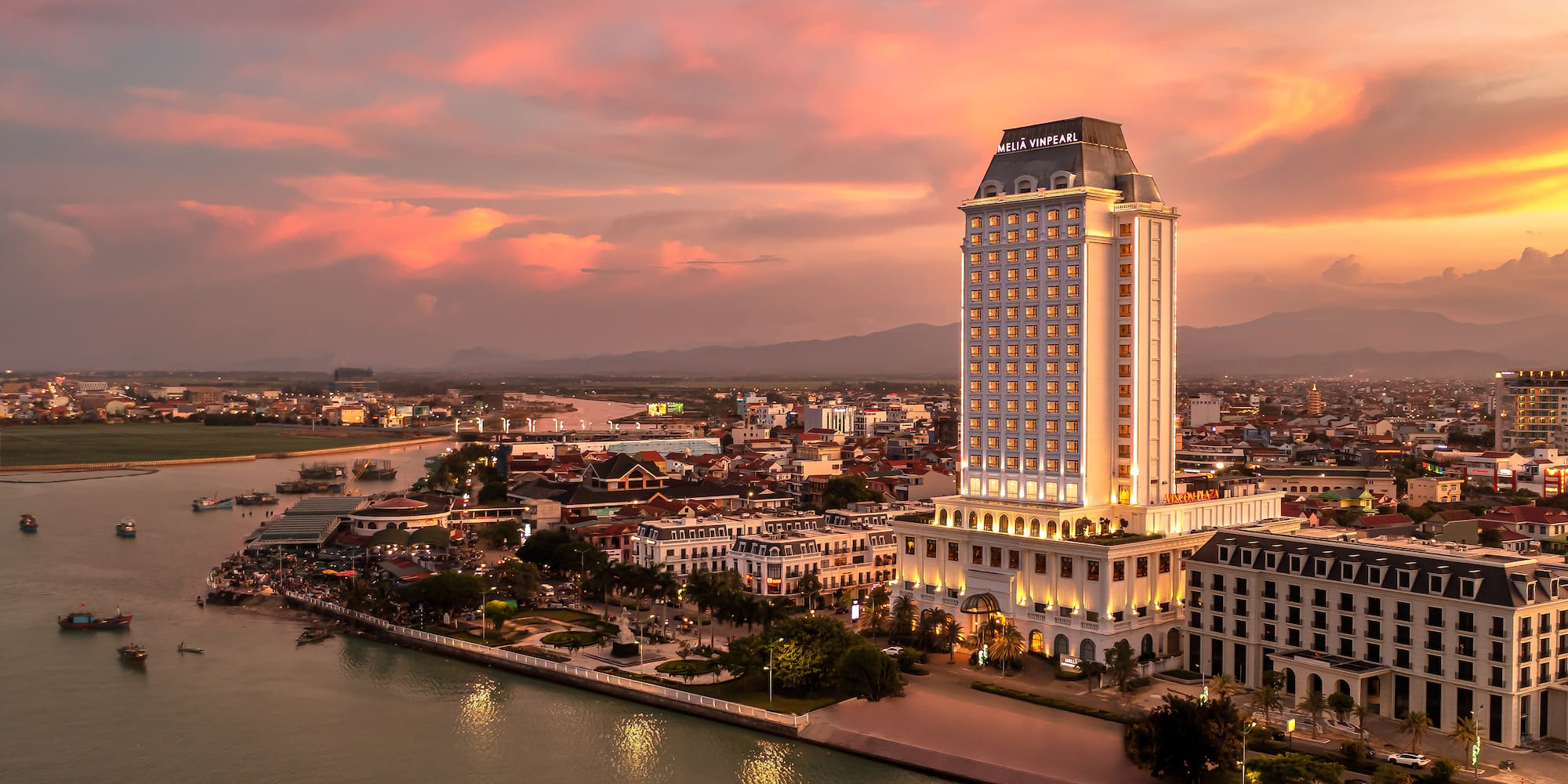 a large building next to a body of water