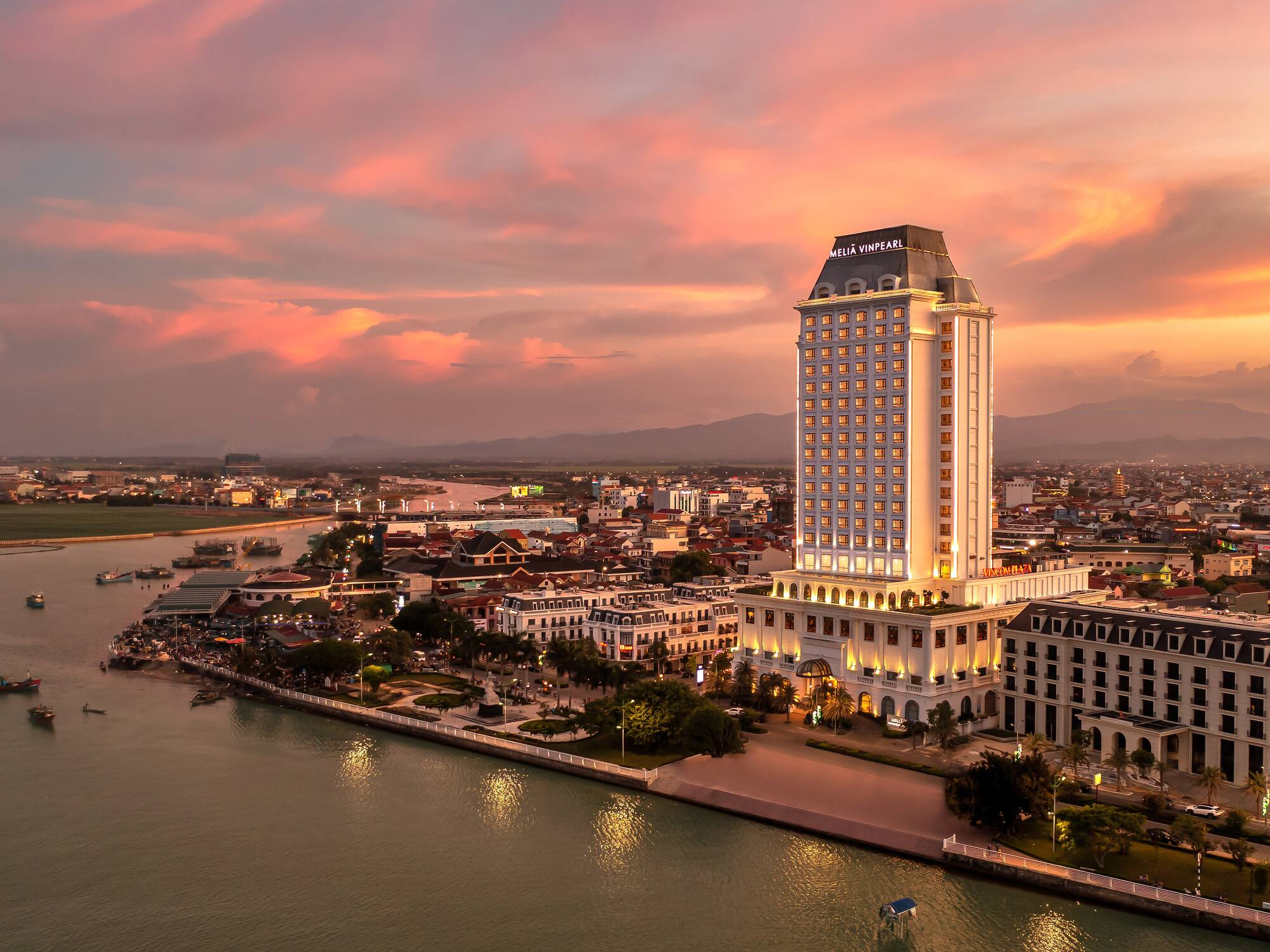 a large building next to a body of water