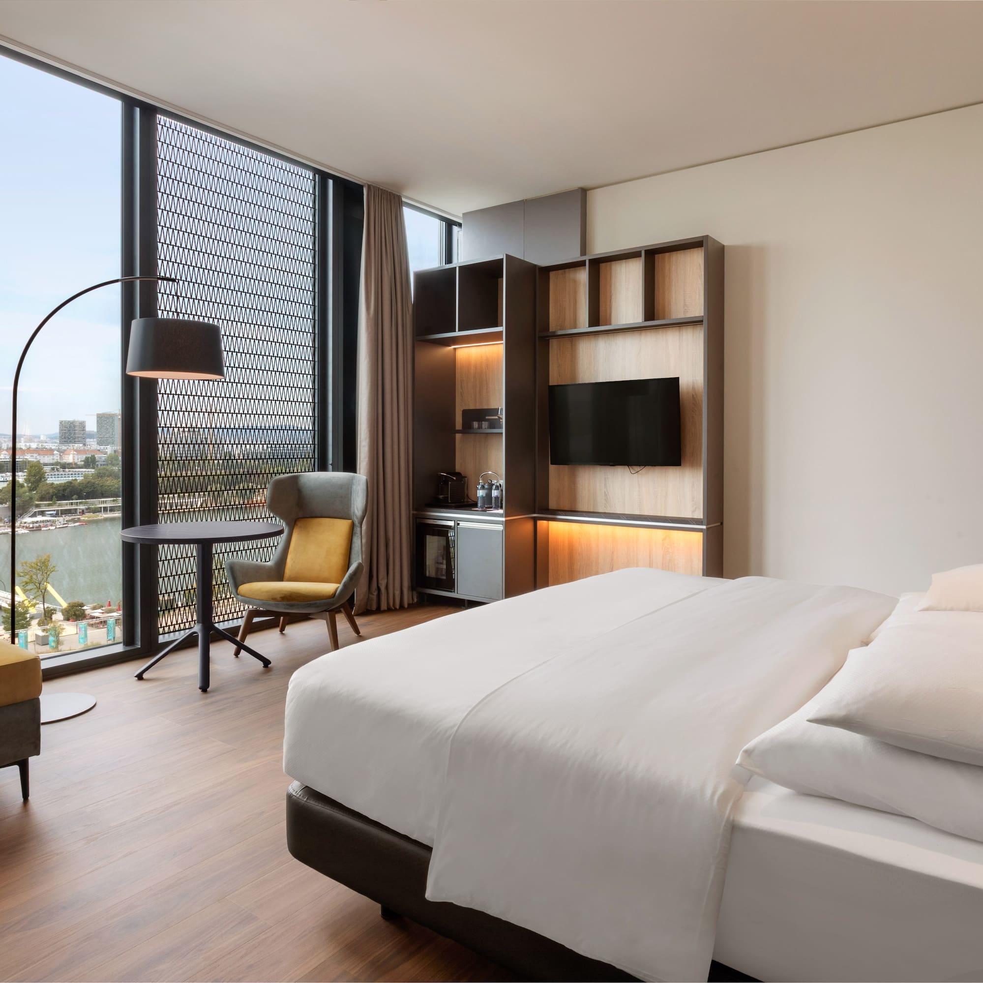 a room with a bed and a tv