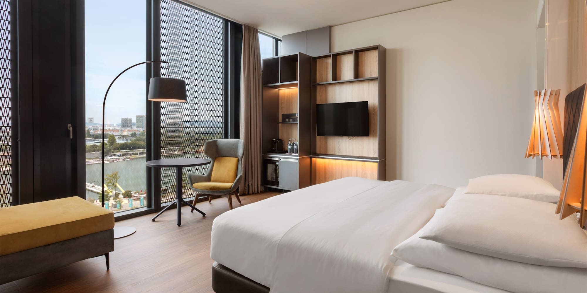 a room with a bed and a tv