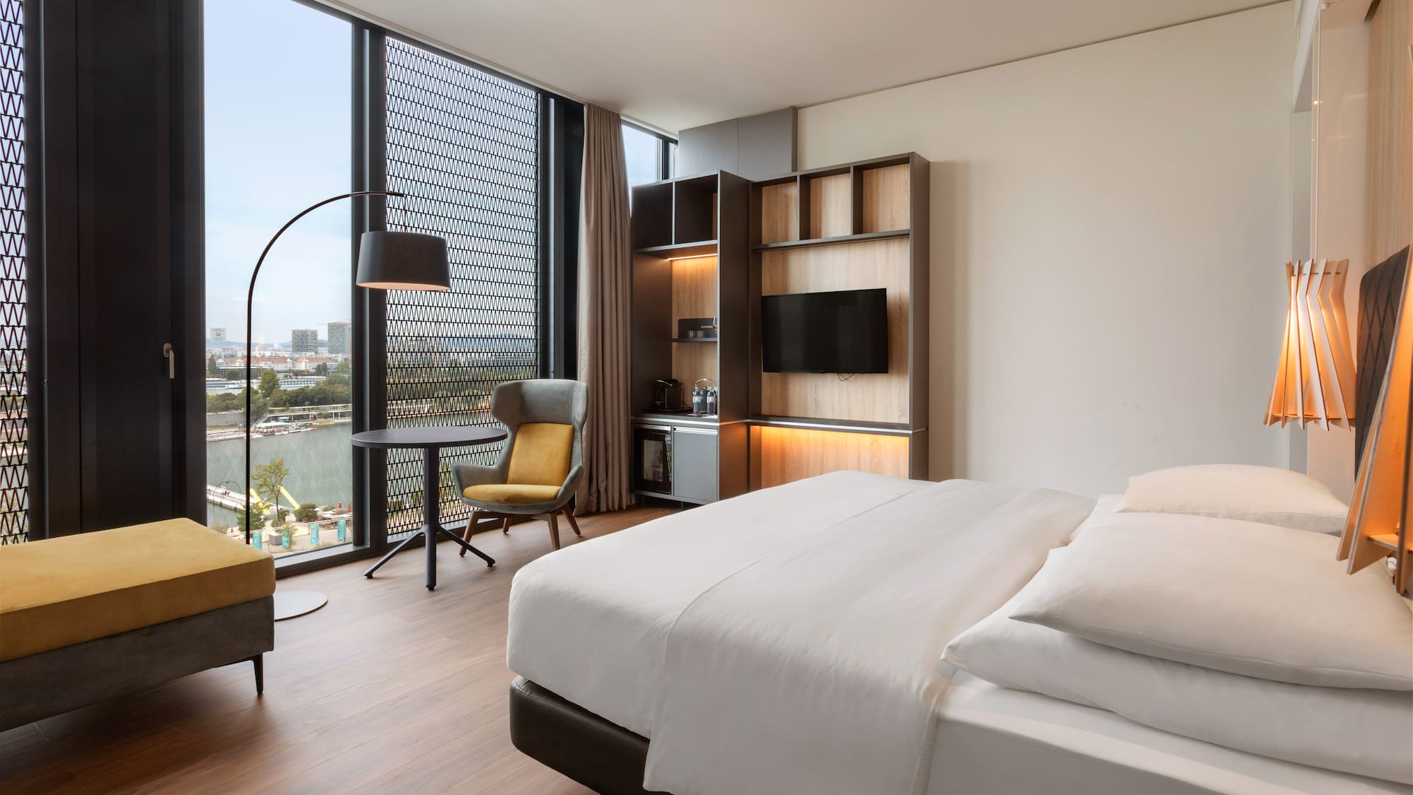 a room with a bed and a tv