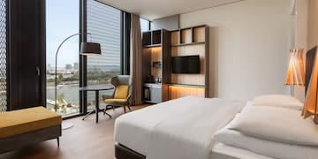 a room with a bed and a tv