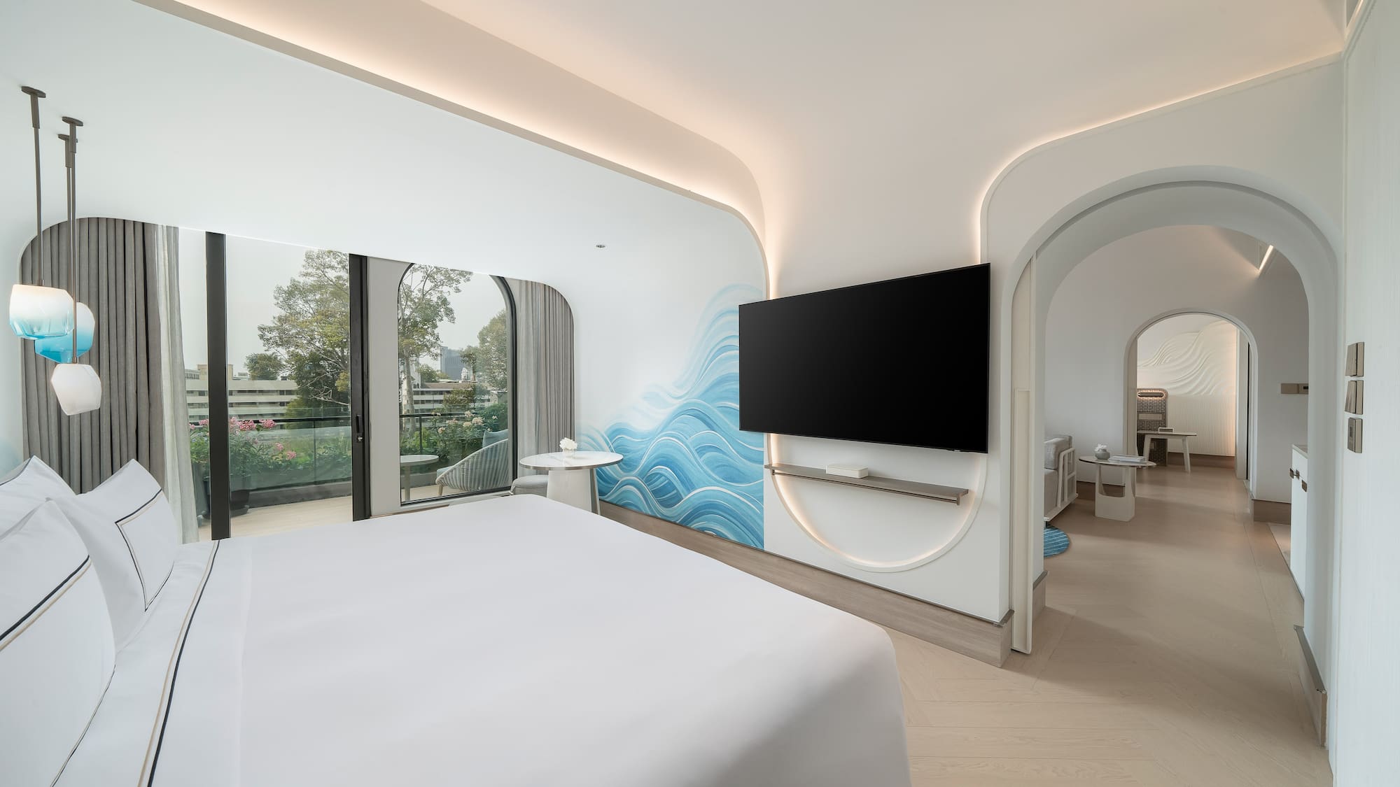 a room with a bed and a television