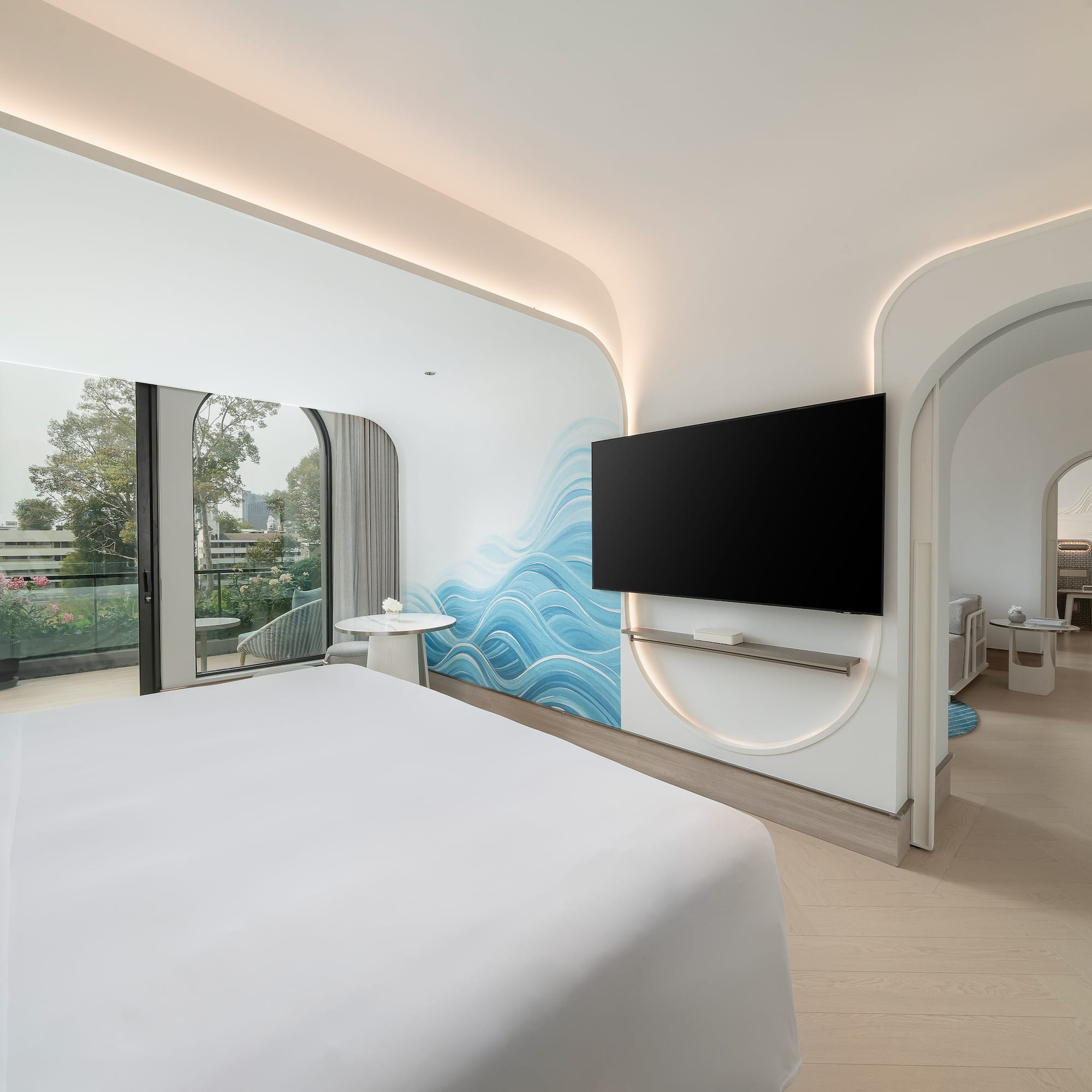 a room with a bed and a television