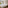 Modern hotel room with two beds, balcony, green headboard, and warm lighting.