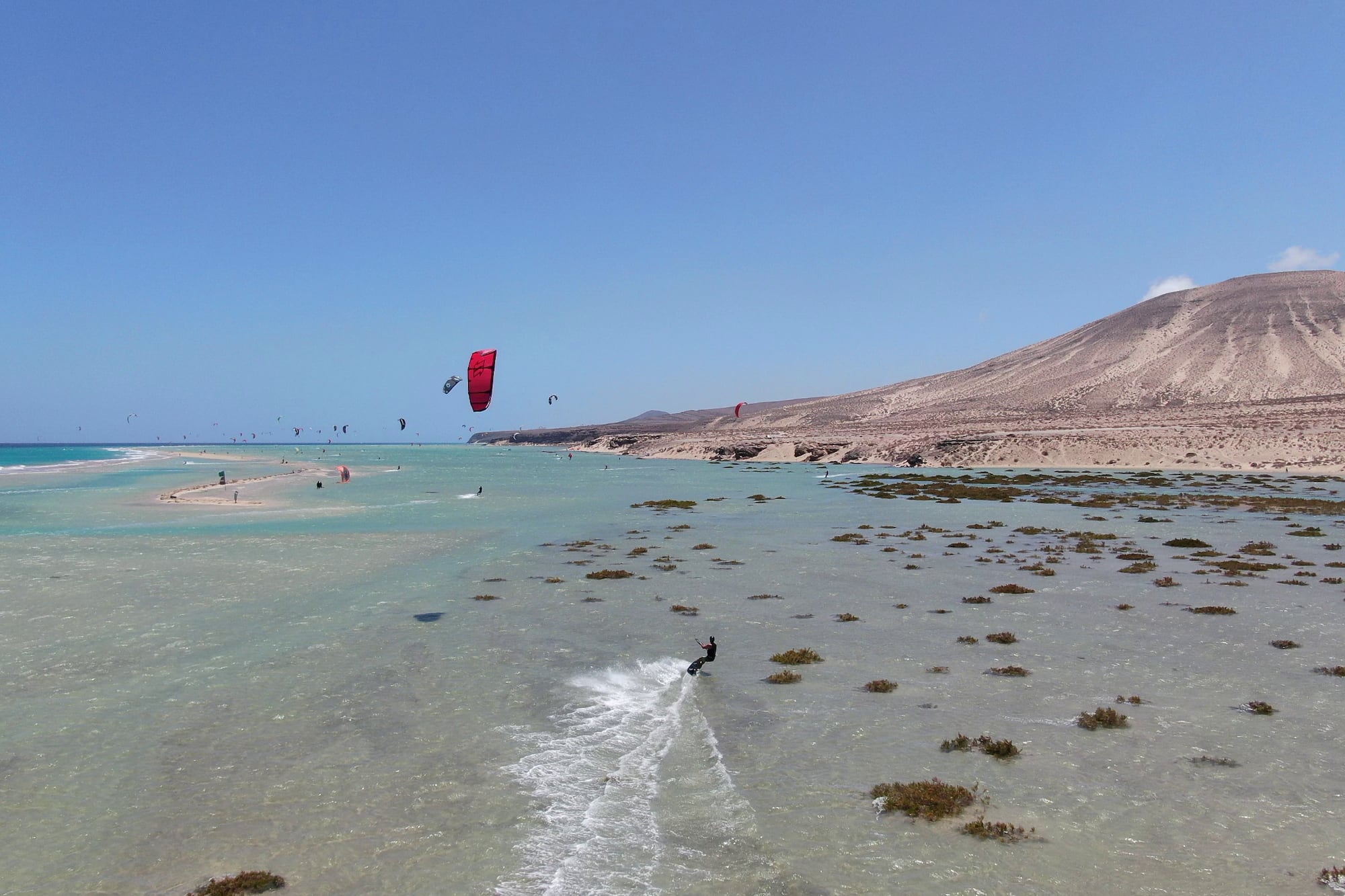 a person parasailing on a beach