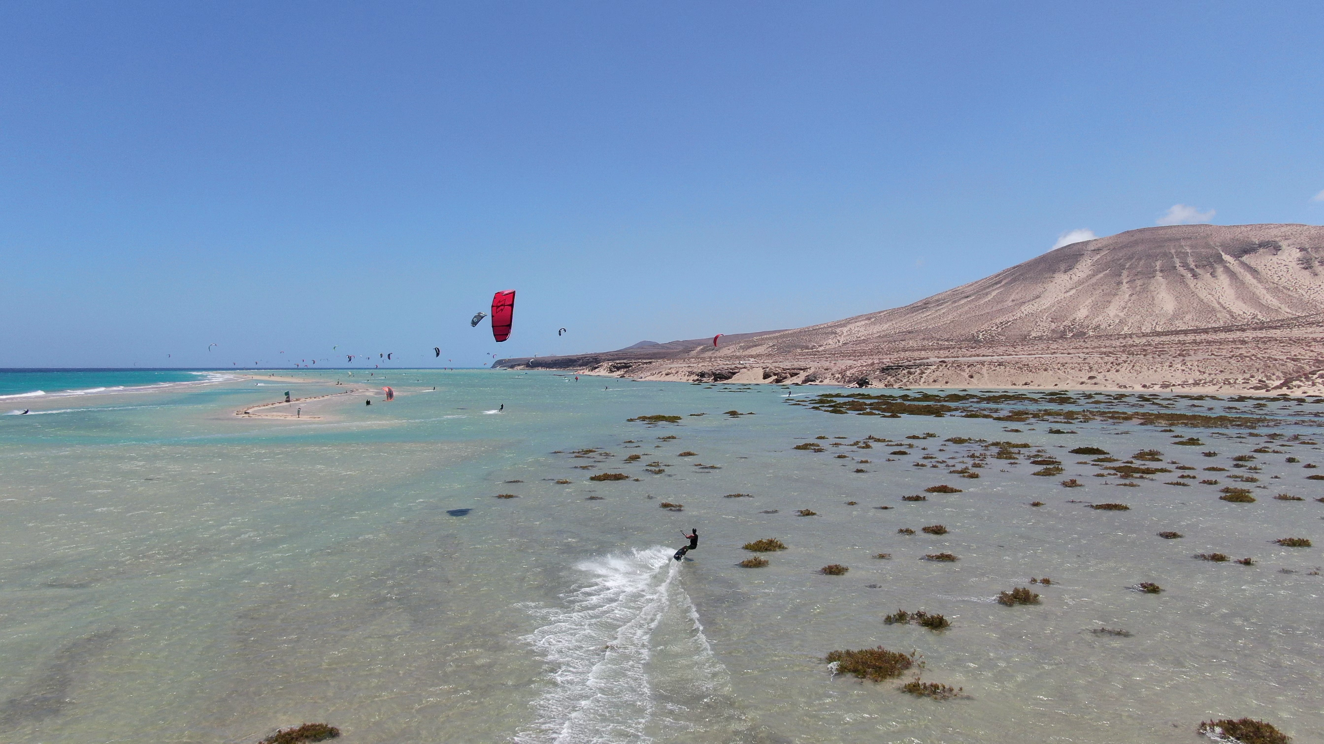 a person parasailing on a beach