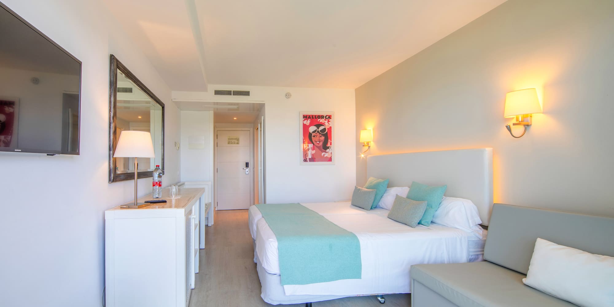 a bedroom with a bed and a couch