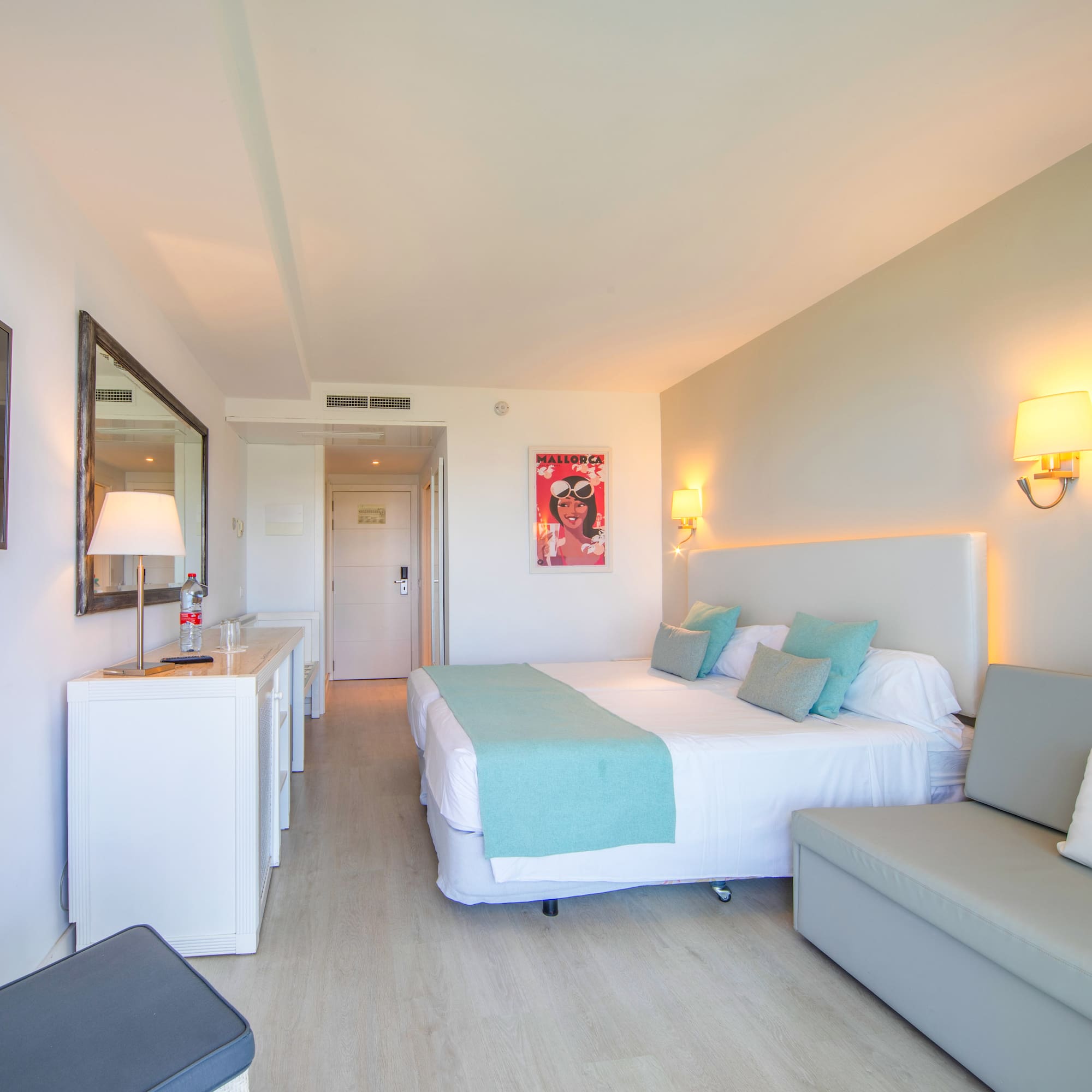 a bedroom with a bed and a couch