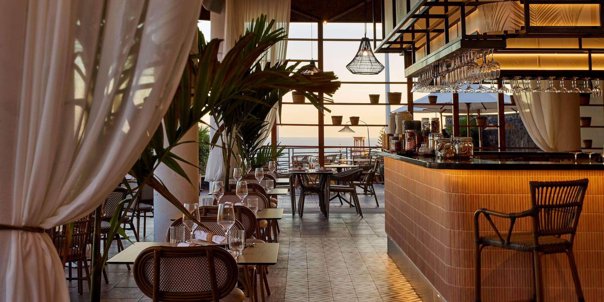 a restaurant with tables and chairs