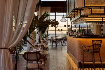 a restaurant with tables and chairs