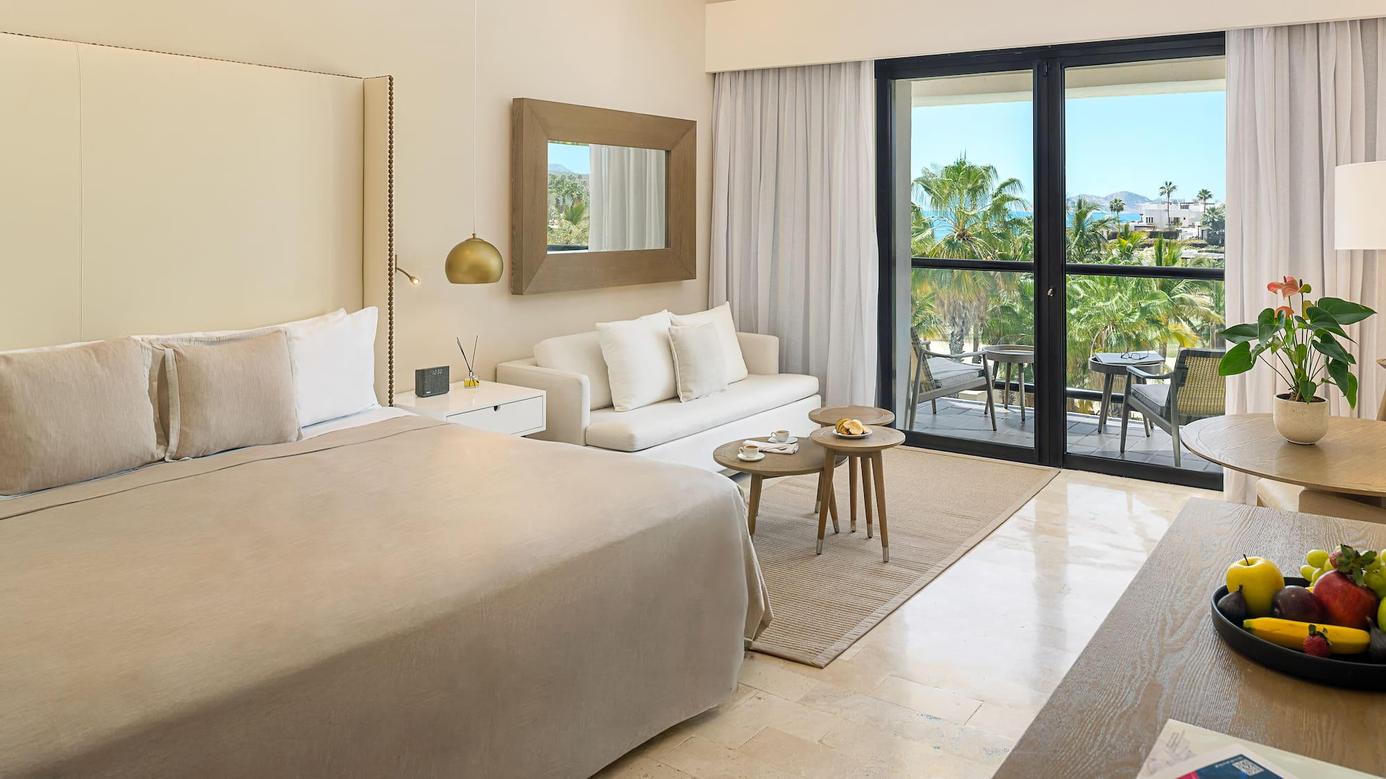 a bedroom with a bed and a couch