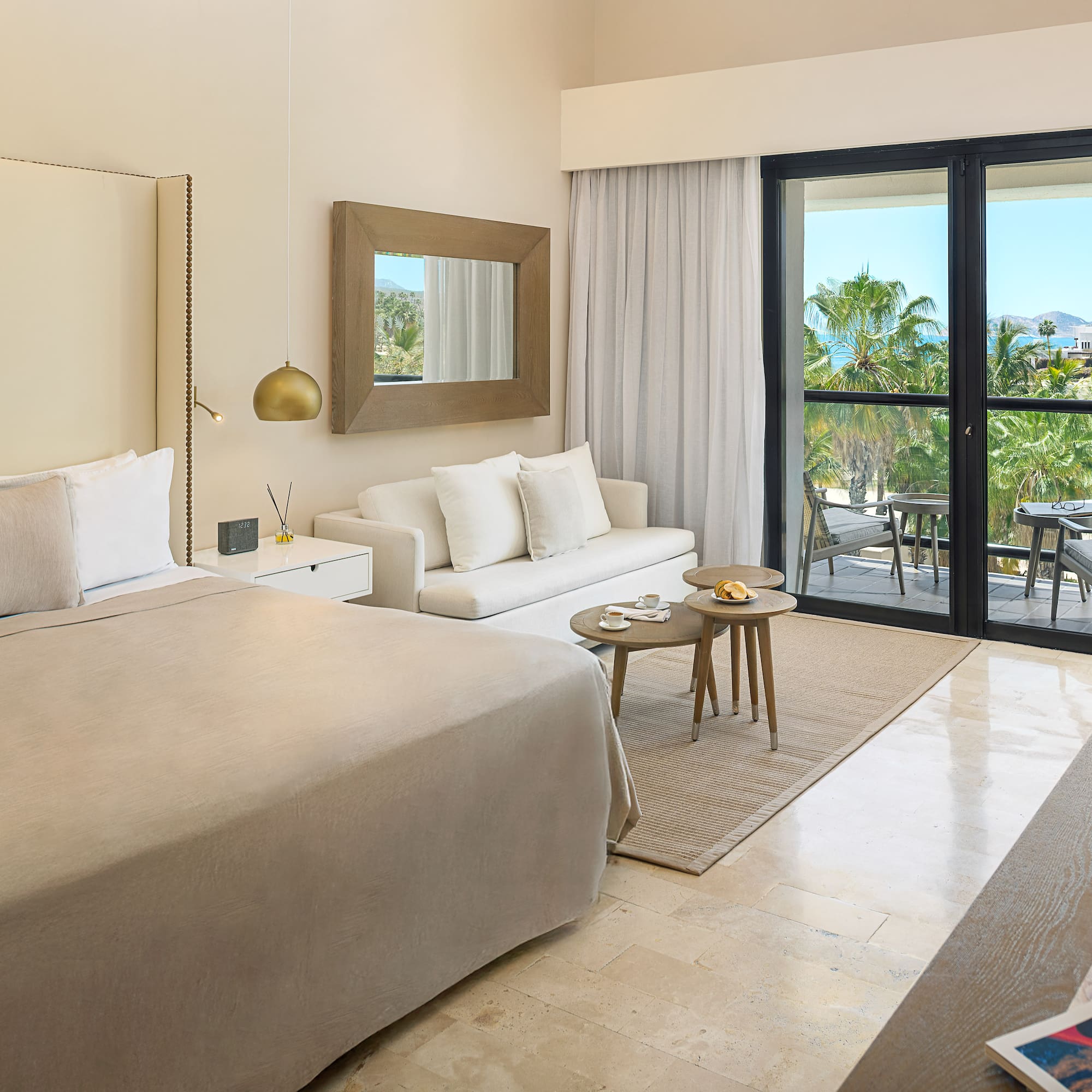 a bedroom with a bed and a couch