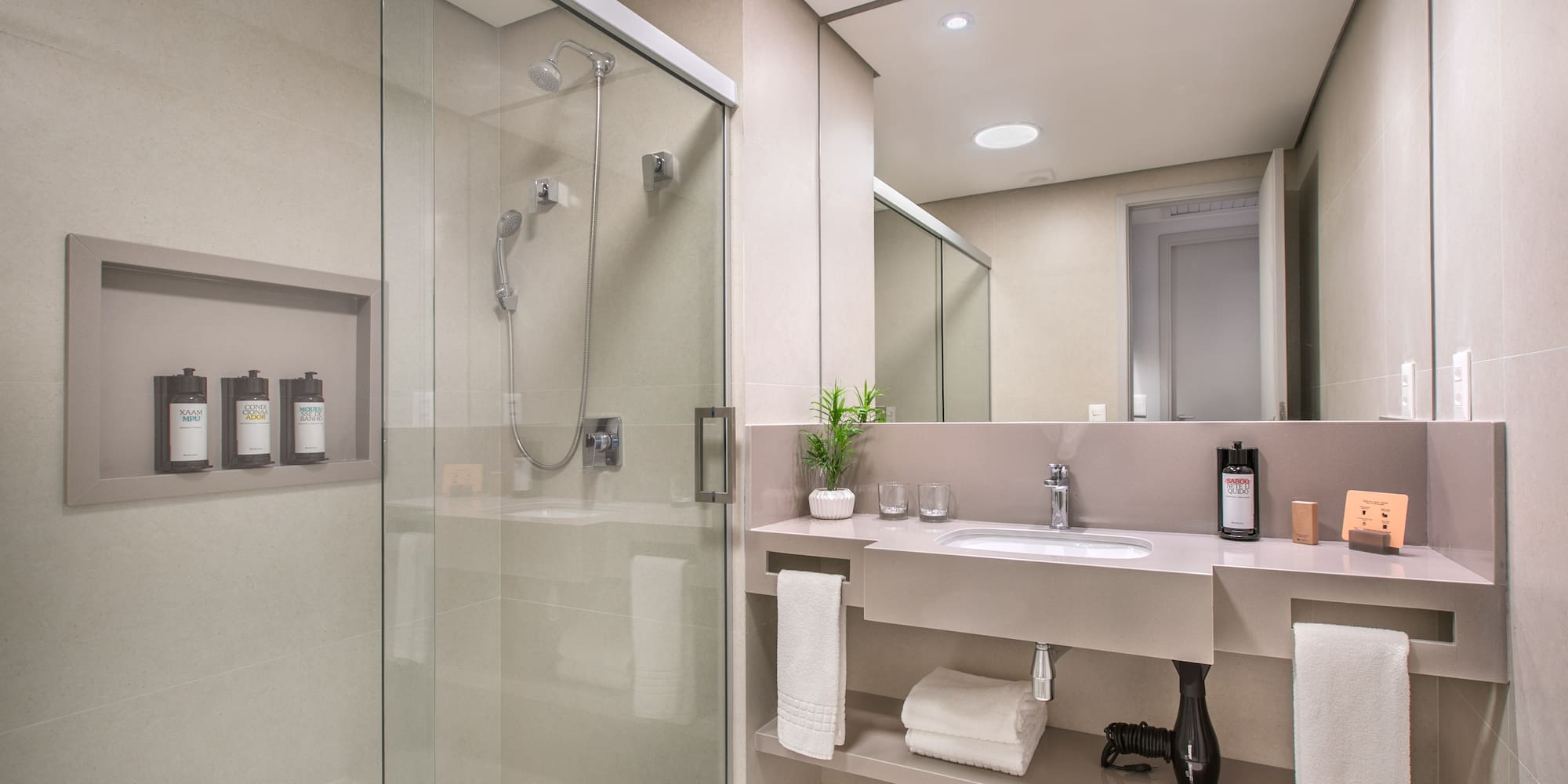 a bathroom with a shower and sink