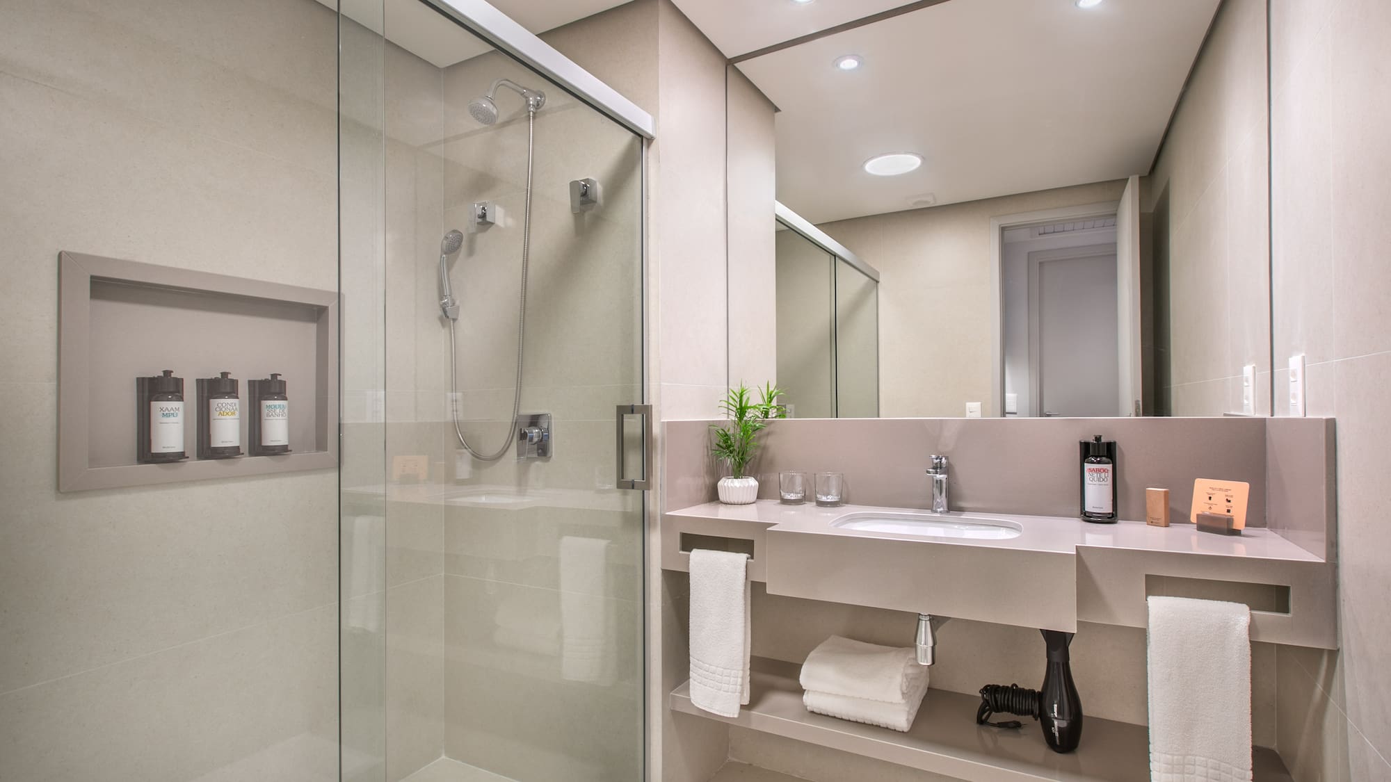 a bathroom with a shower and sink