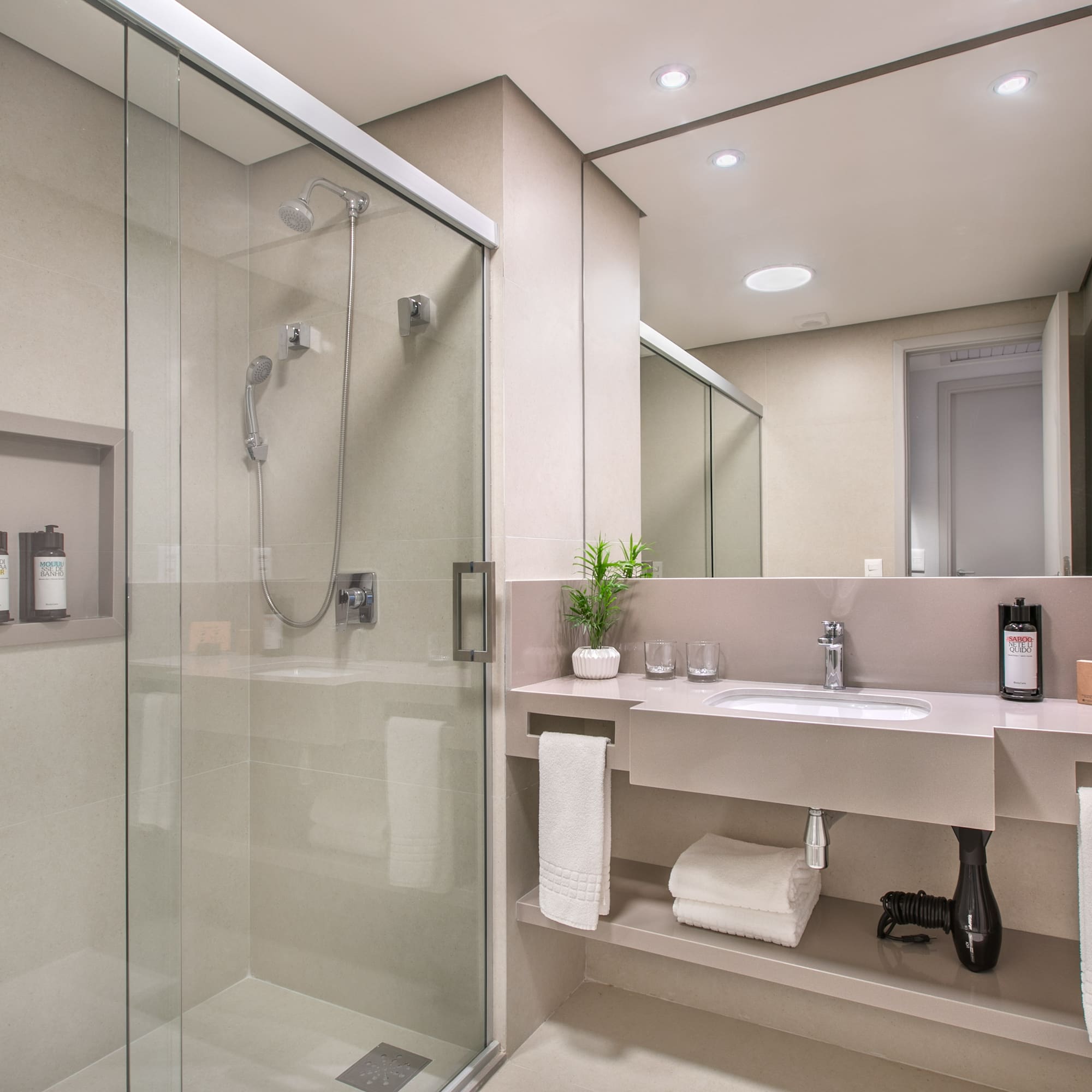 a bathroom with a shower and sink