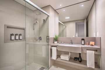 a bathroom with a shower and sink