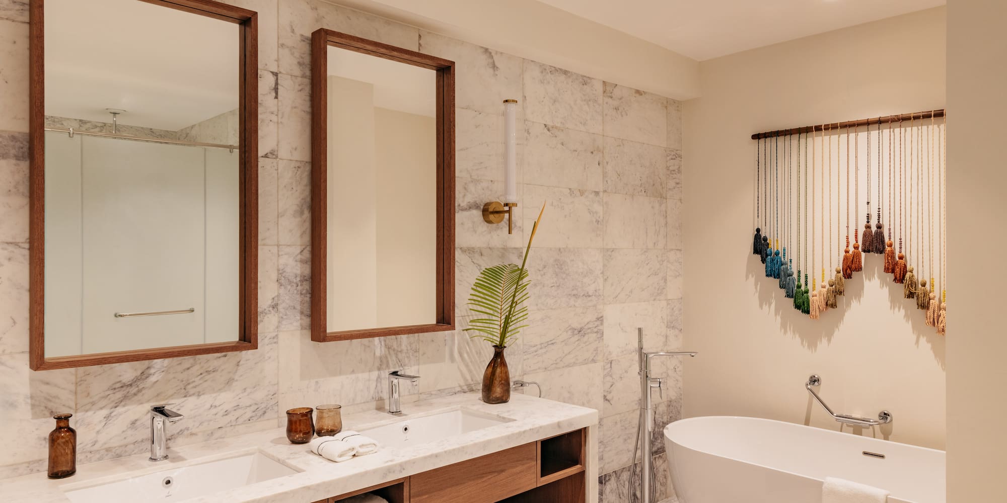 a bathroom with a tub and mirrors