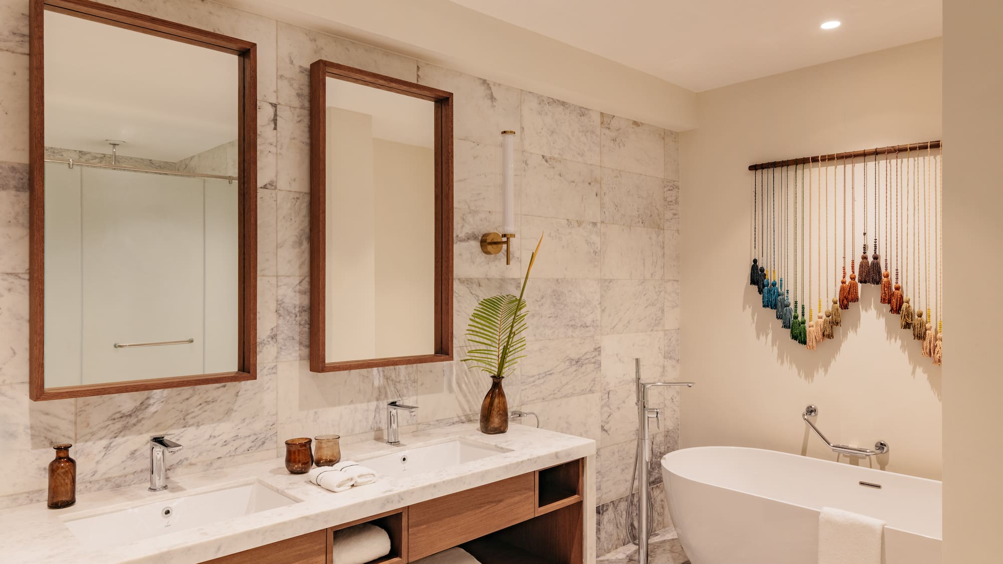 a bathroom with a tub and mirrors