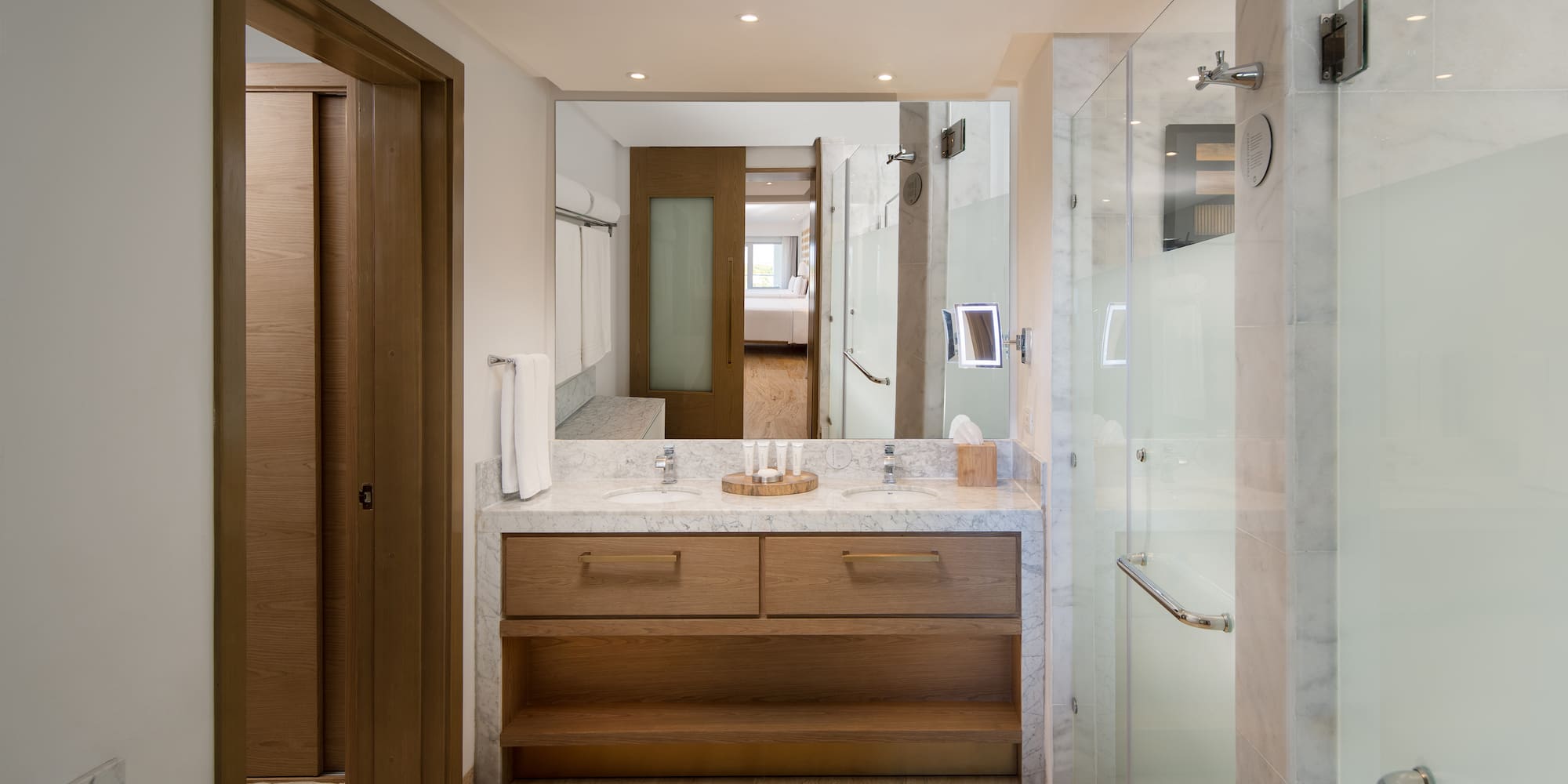 a bathroom with a marble countertop and a shower